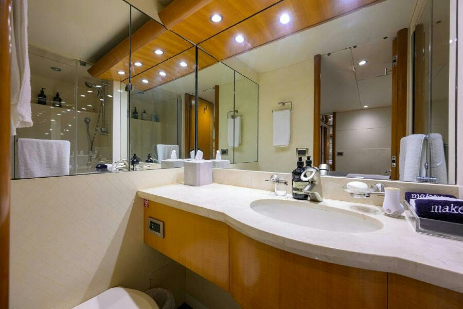 a bathroom with a large mirror aboard LIVING THE DREAM Yacht for Sale