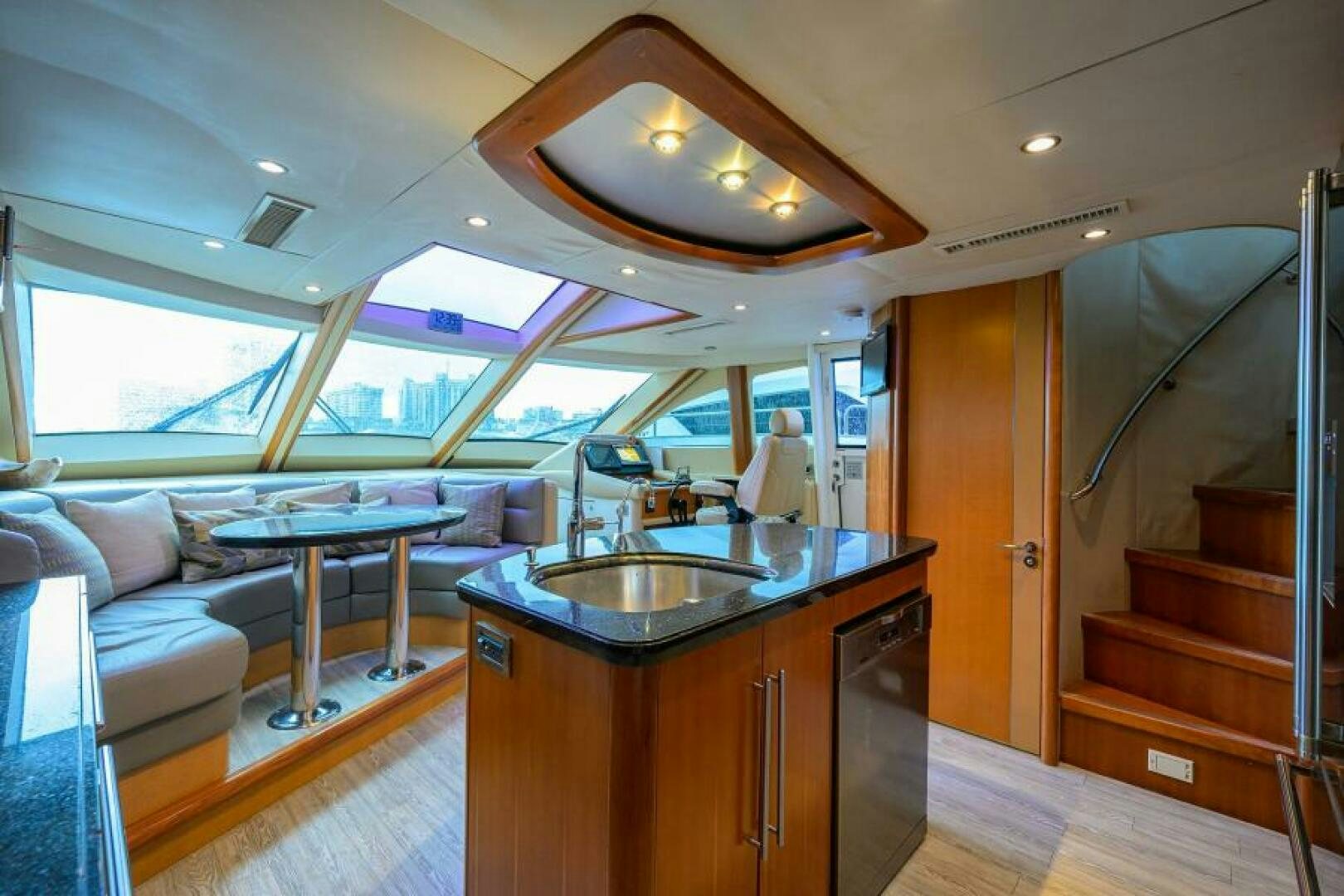 a kitchen with a sink and a large window aboard LIVING THE DREAM Yacht for Sale