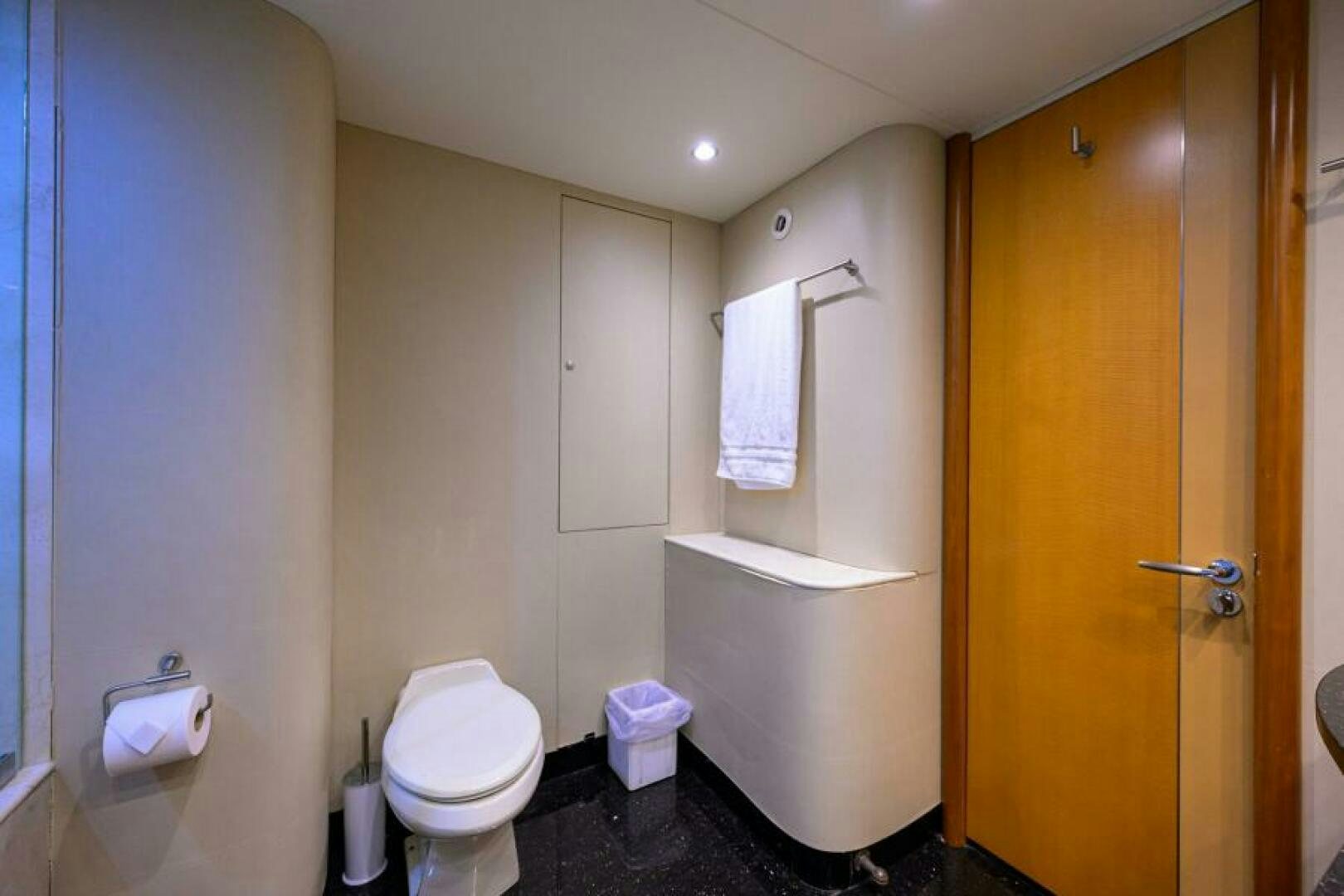 a bathroom with a toilet and a shower aboard LIVING THE DREAM Yacht for Sale