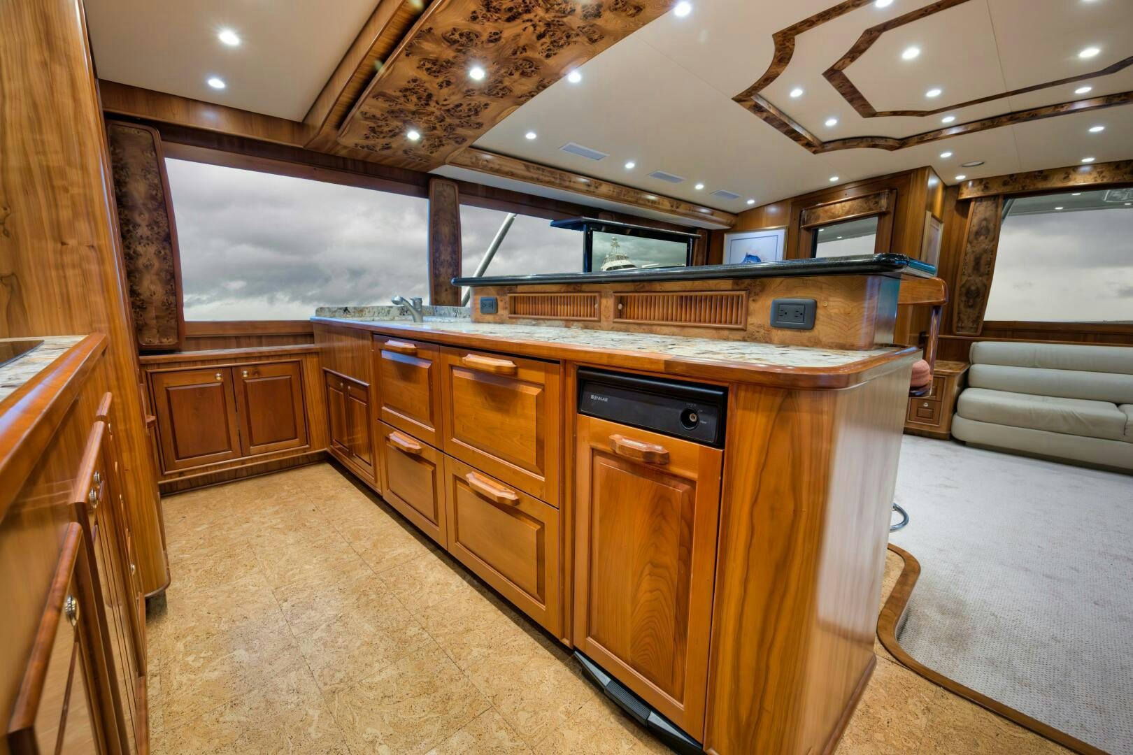 a large kitchen with wooden cabinets aboard ANN WARRICK Yacht for Sale
