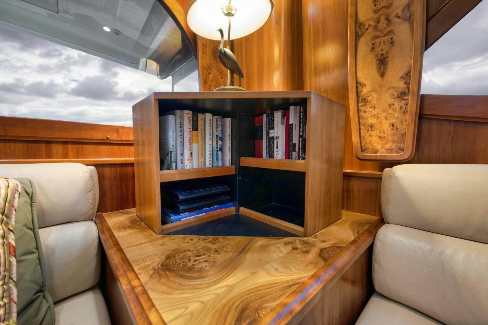 a living room with a book shelf aboard ANN WARRICK Yacht for Sale