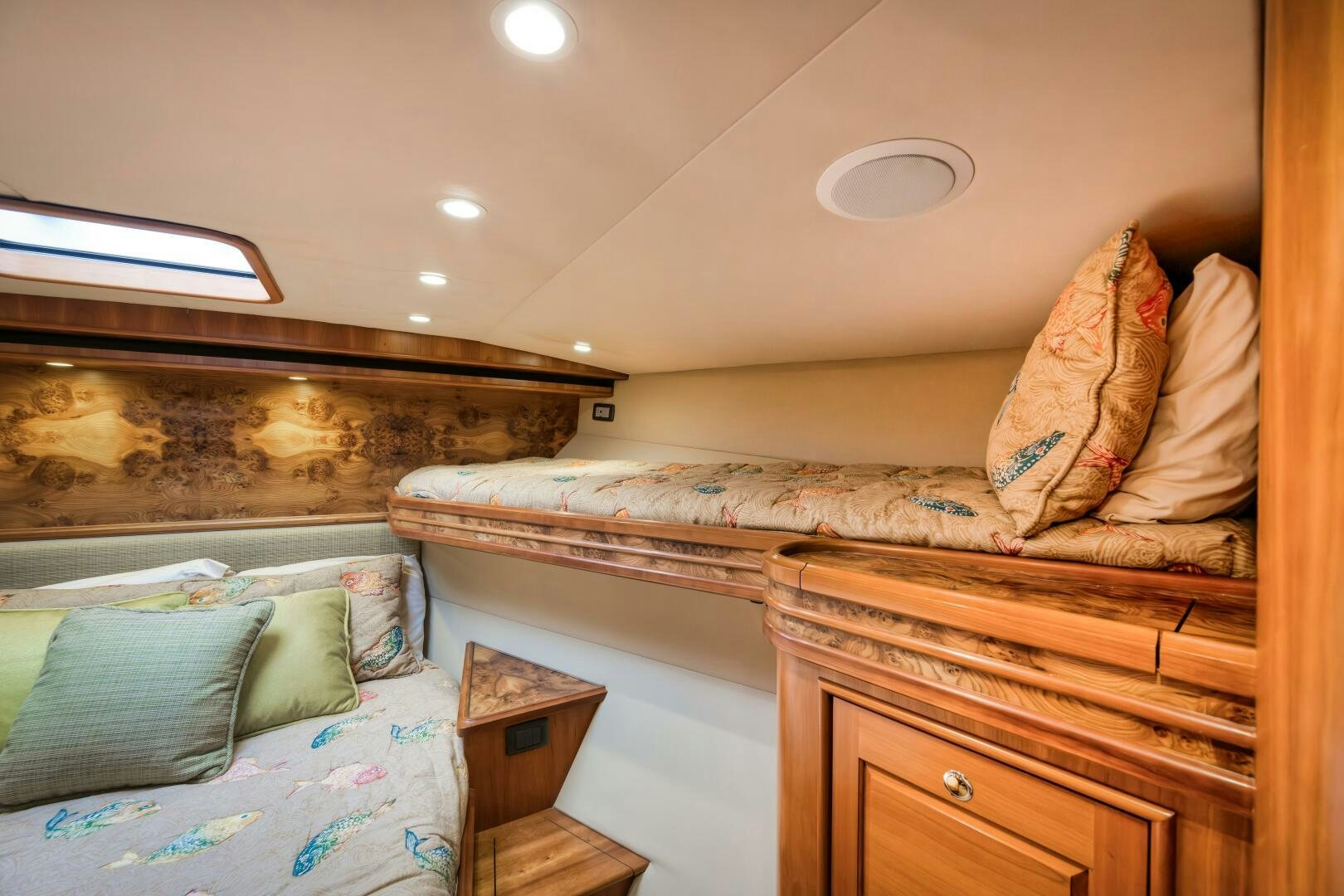 a bedroom with a bed and a dresser aboard ANN WARRICK Yacht for Sale