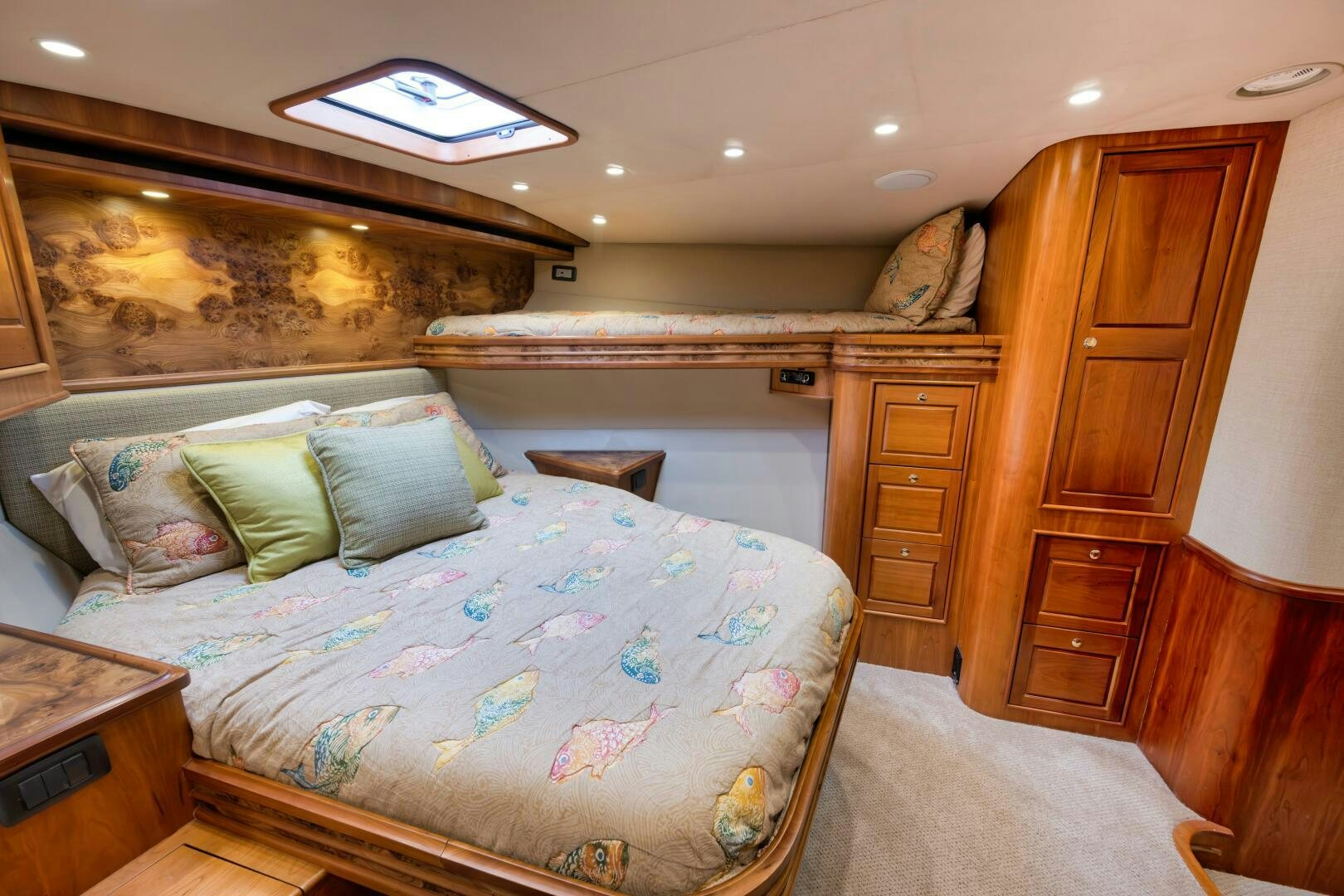 a bedroom with a bed and dresser aboard ANN WARRICK Yacht for Sale