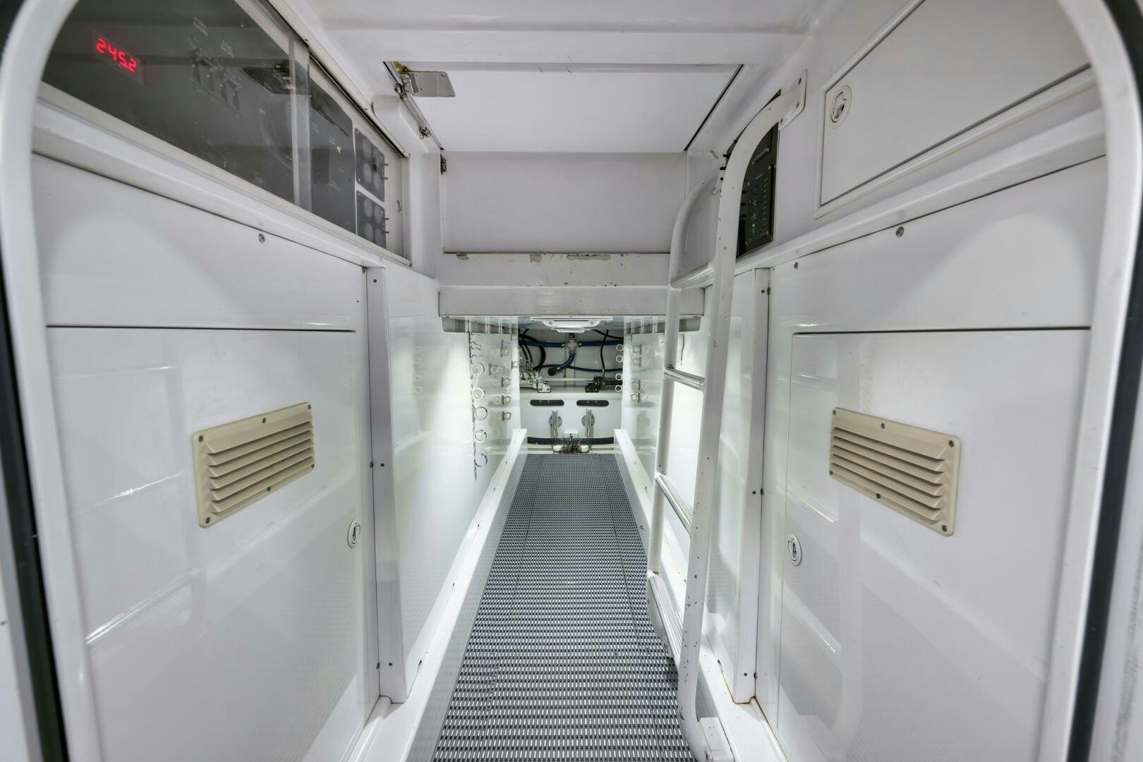 a long hallway with white doors aboard ANN WARRICK Yacht for Sale