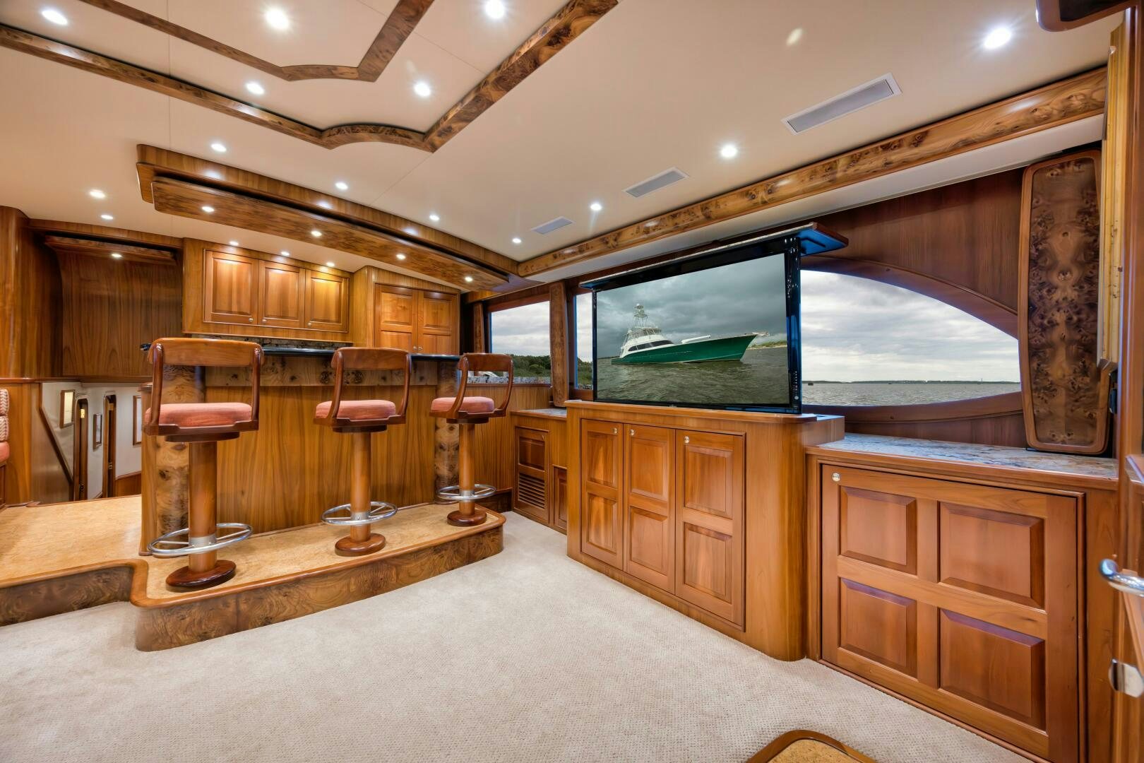 a room with wooden cabinets and a large mirror aboard ANN WARRICK Yacht for Sale