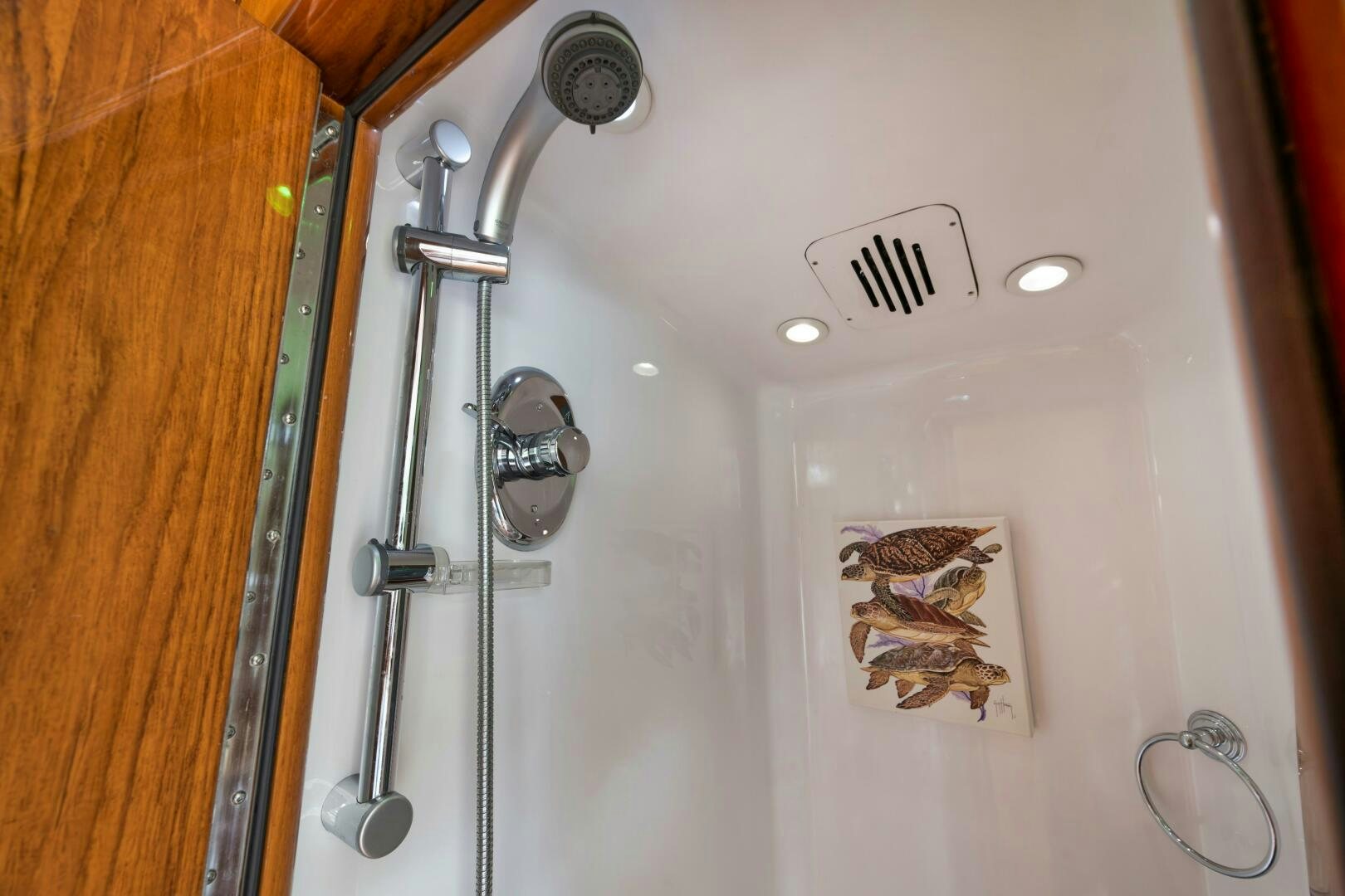 a wall with a shower head and a mirror aboard ANN WARRICK Yacht for Sale