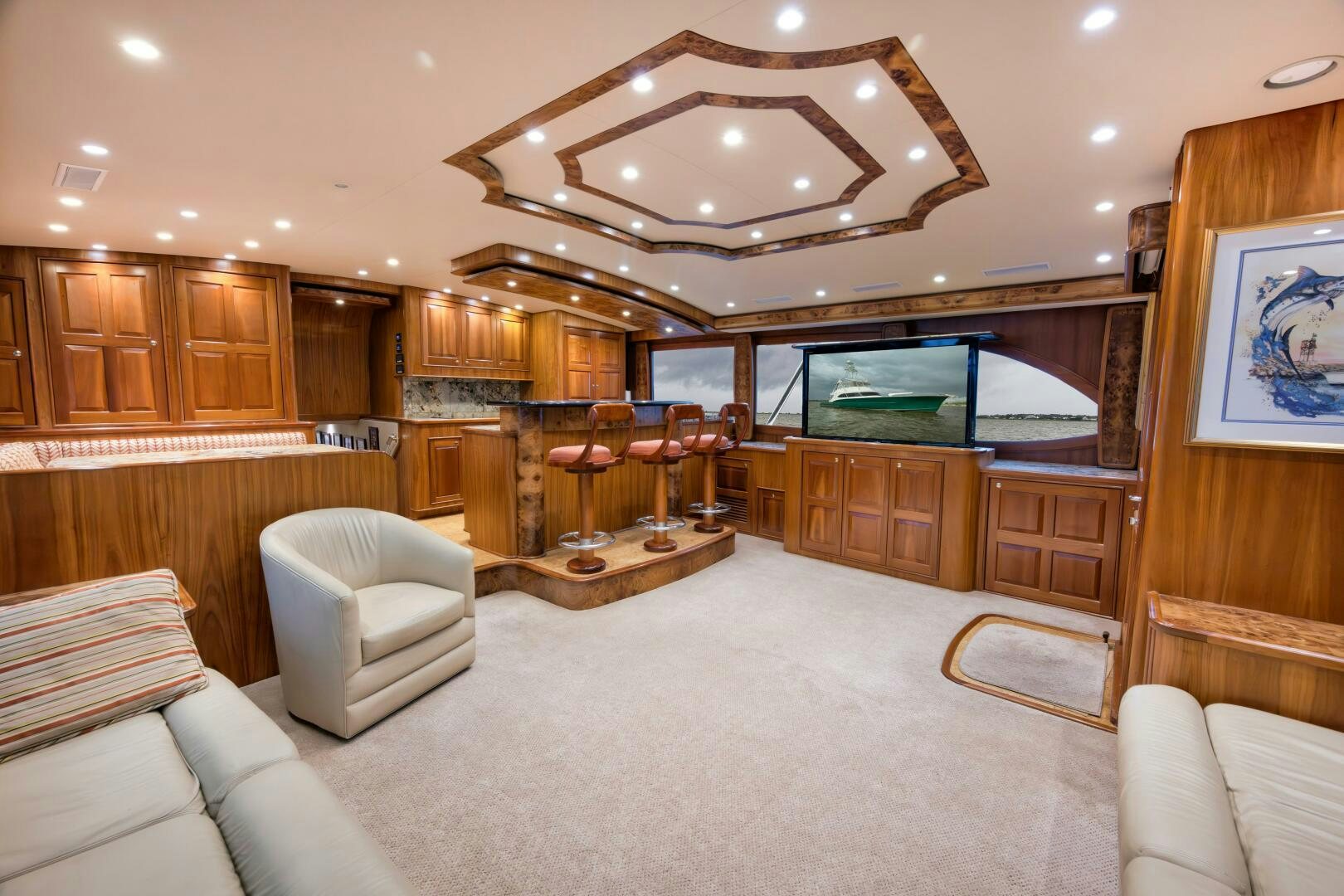 a living room with a large screen aboard ANN WARRICK Yacht for Sale