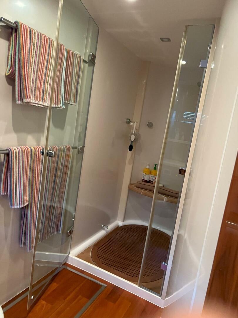 a bathroom with a glass shower aboard NONE Yacht for Sale