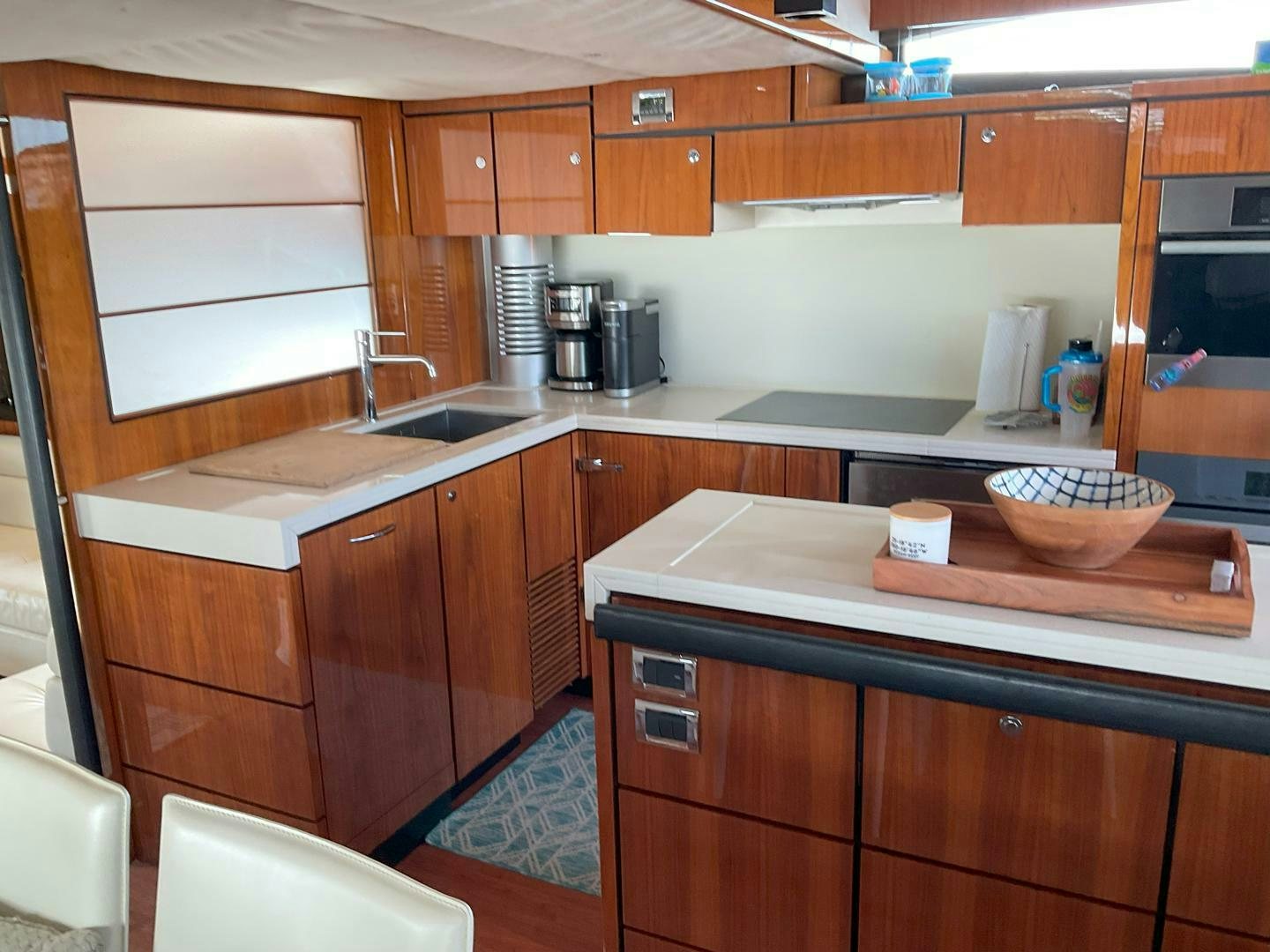 a kitchen with wooden cabinets aboard NONE Yacht for Sale