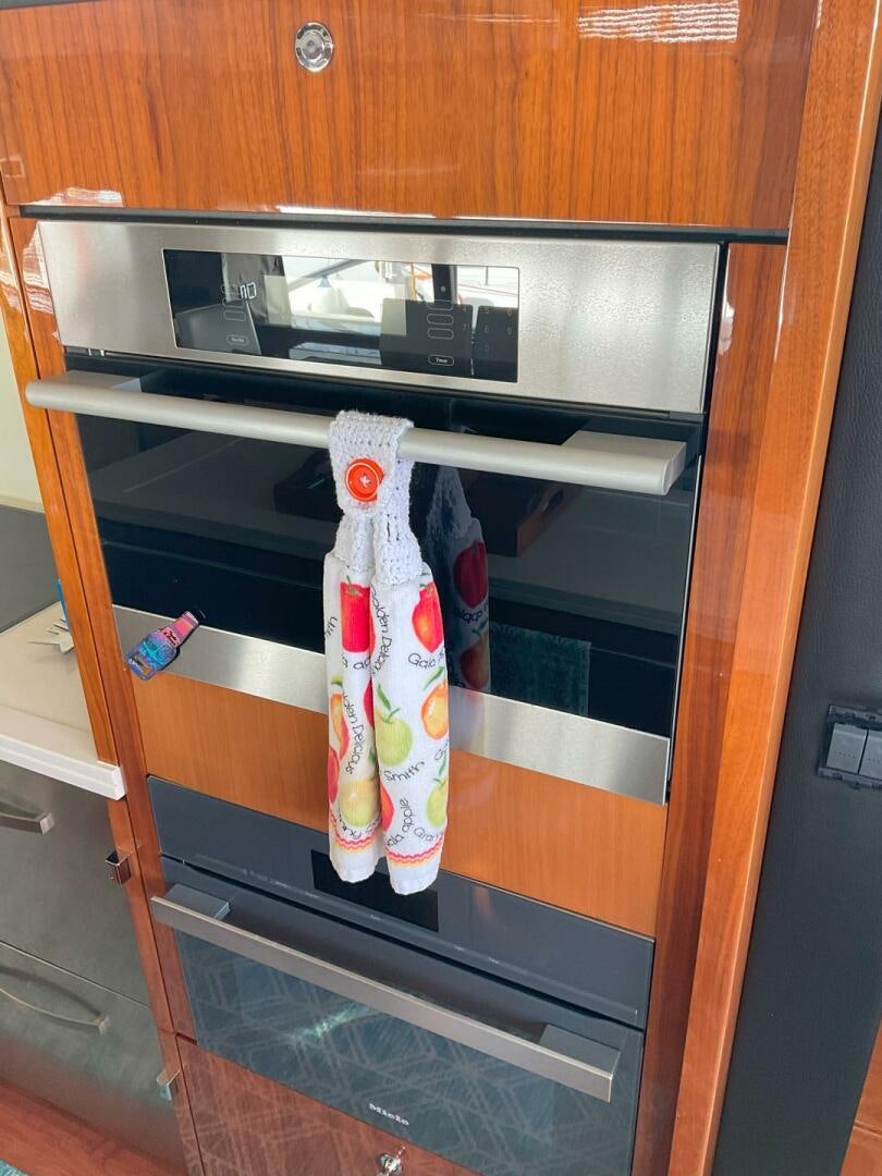 a couple of socks swing from a oven door aboard NONE Yacht for Sale