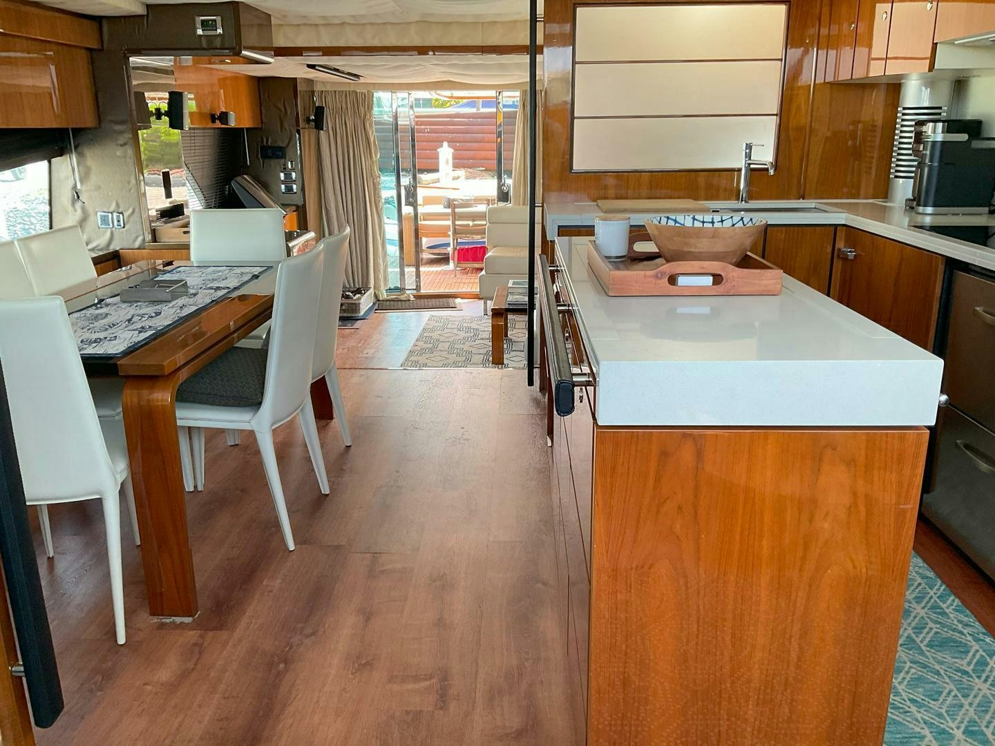 a kitchen with a table and chairs aboard NONE Yacht for Sale