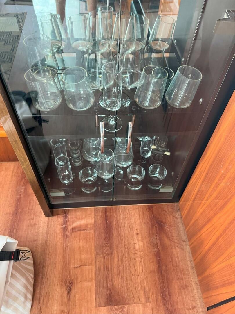 a glass case with glasses aboard NONE Yacht for Sale