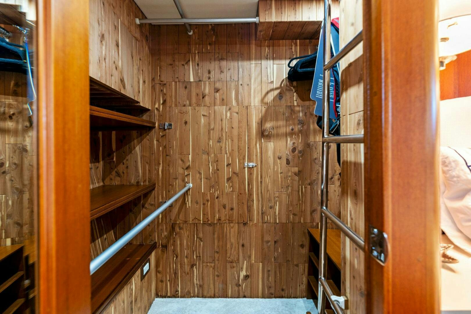 a room with wooden walls and a ladder aboard RELENTLESS Yacht for Sale
