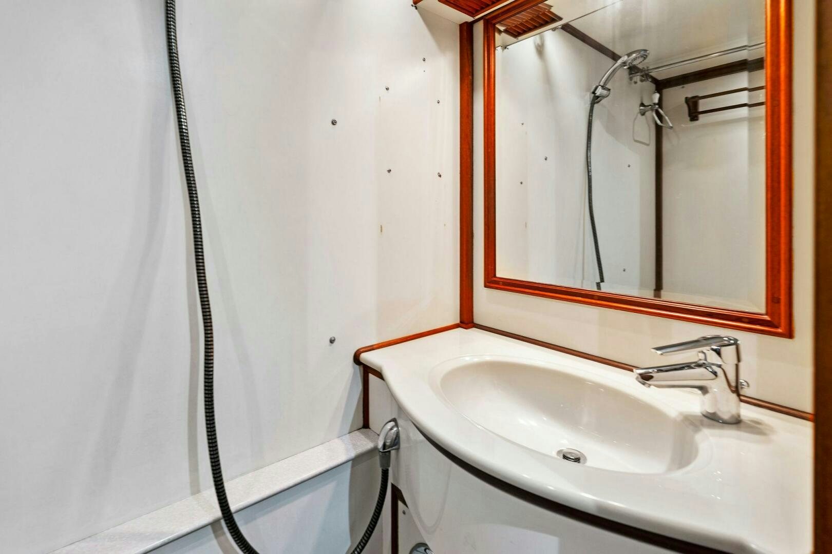 a sink and mirror aboard RELENTLESS Yacht for Sale