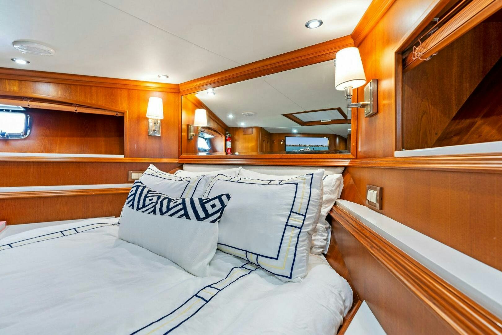 a bed with pillows aboard RELENTLESS Yacht for Sale