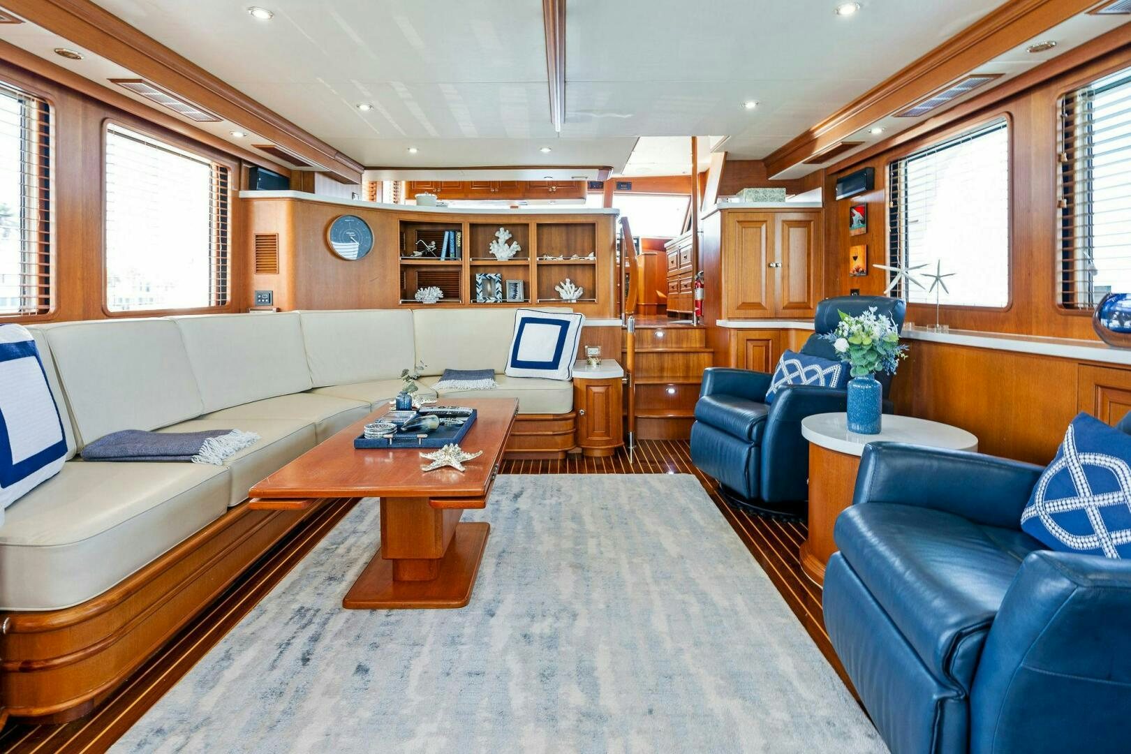 a living room with a couch and a coffee table aboard RELENTLESS Yacht for Sale