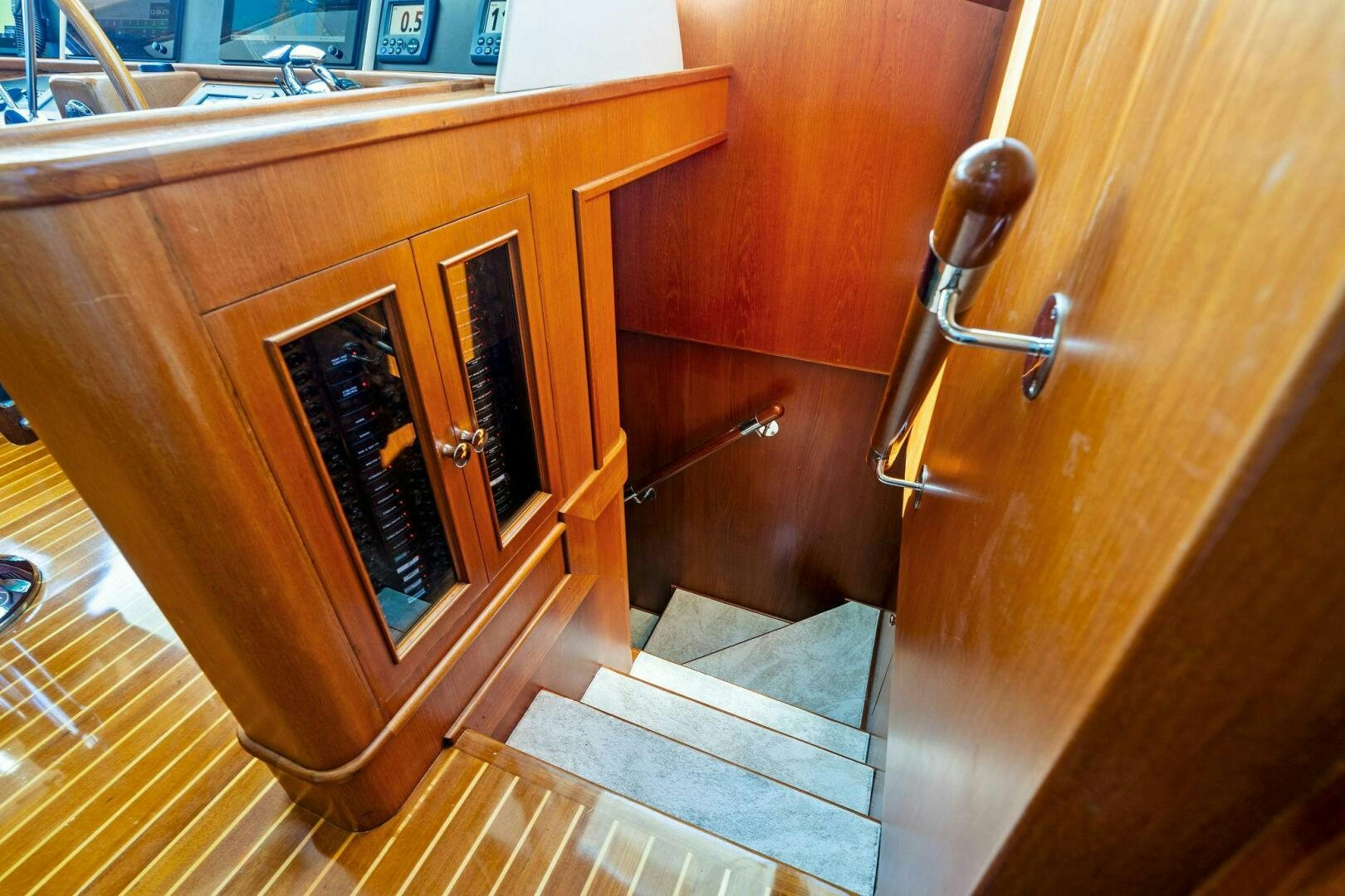 a bathroom with a wood cabinet aboard RELENTLESS Yacht for Sale