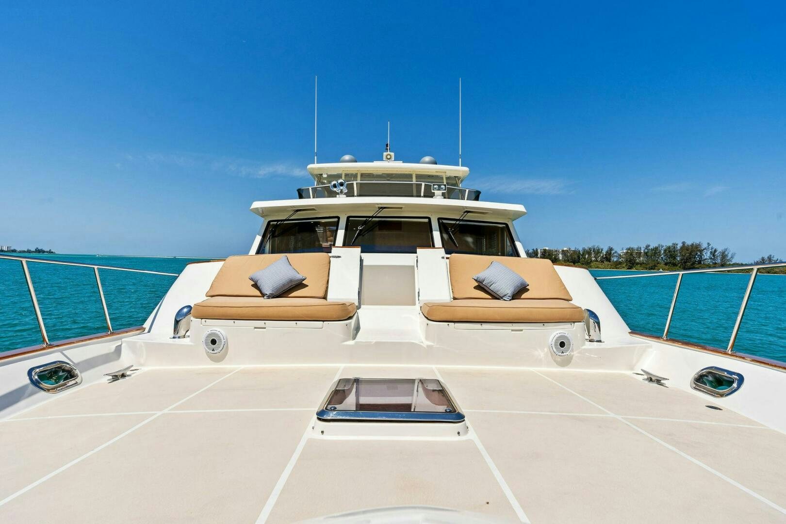 a white boat on a beach aboard RELENTLESS Yacht for Sale