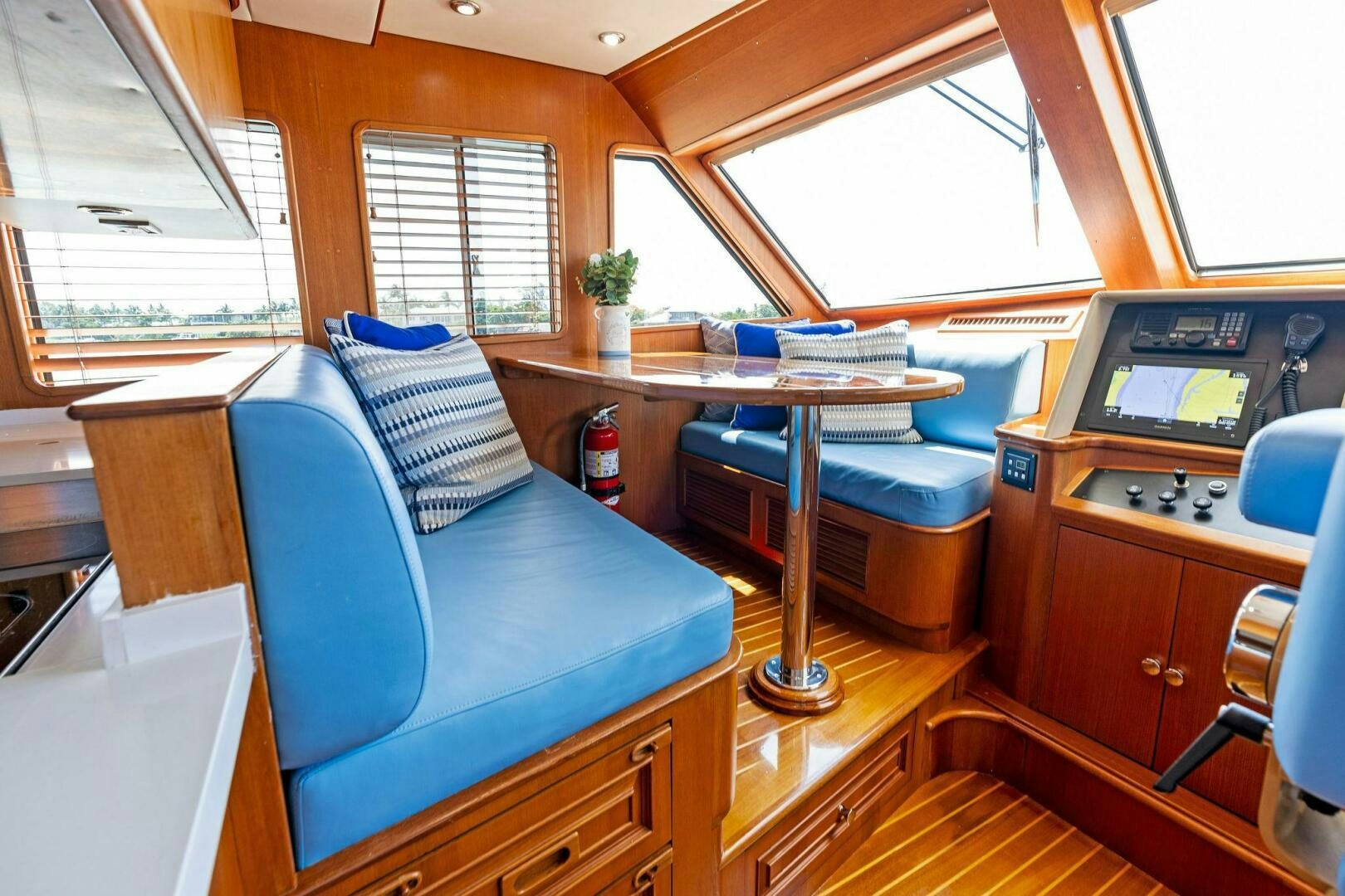 a room with a couch and a table aboard RELENTLESS Yacht for Sale