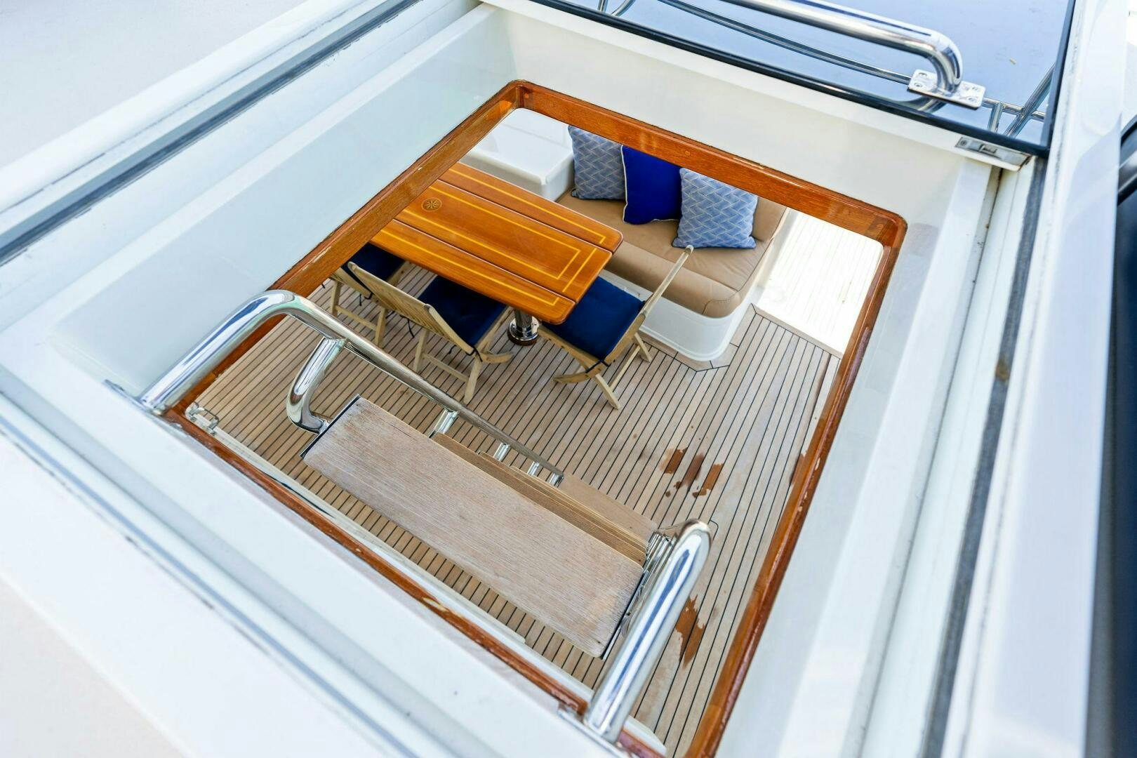 a wooden shelf with a blue object on it aboard RELENTLESS Yacht for Sale