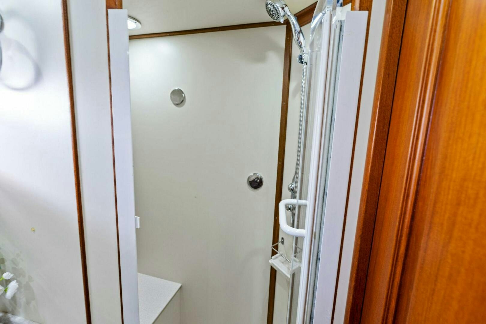 a white door with a handle aboard RELENTLESS Yacht for Sale