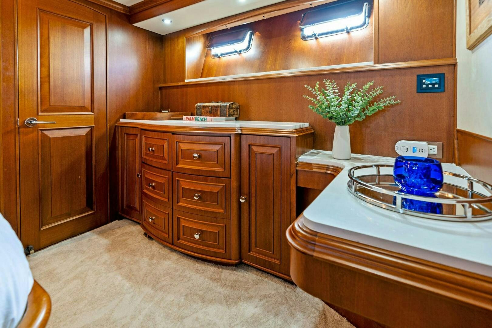 a bathroom with a sink and cabinets aboard RELENTLESS Yacht for Sale