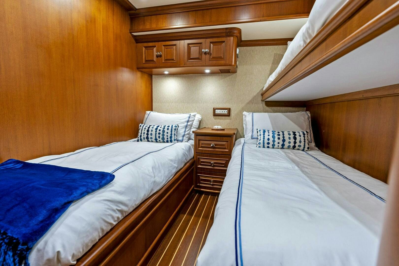 a couple of beds in a room aboard RELENTLESS Yacht for Sale