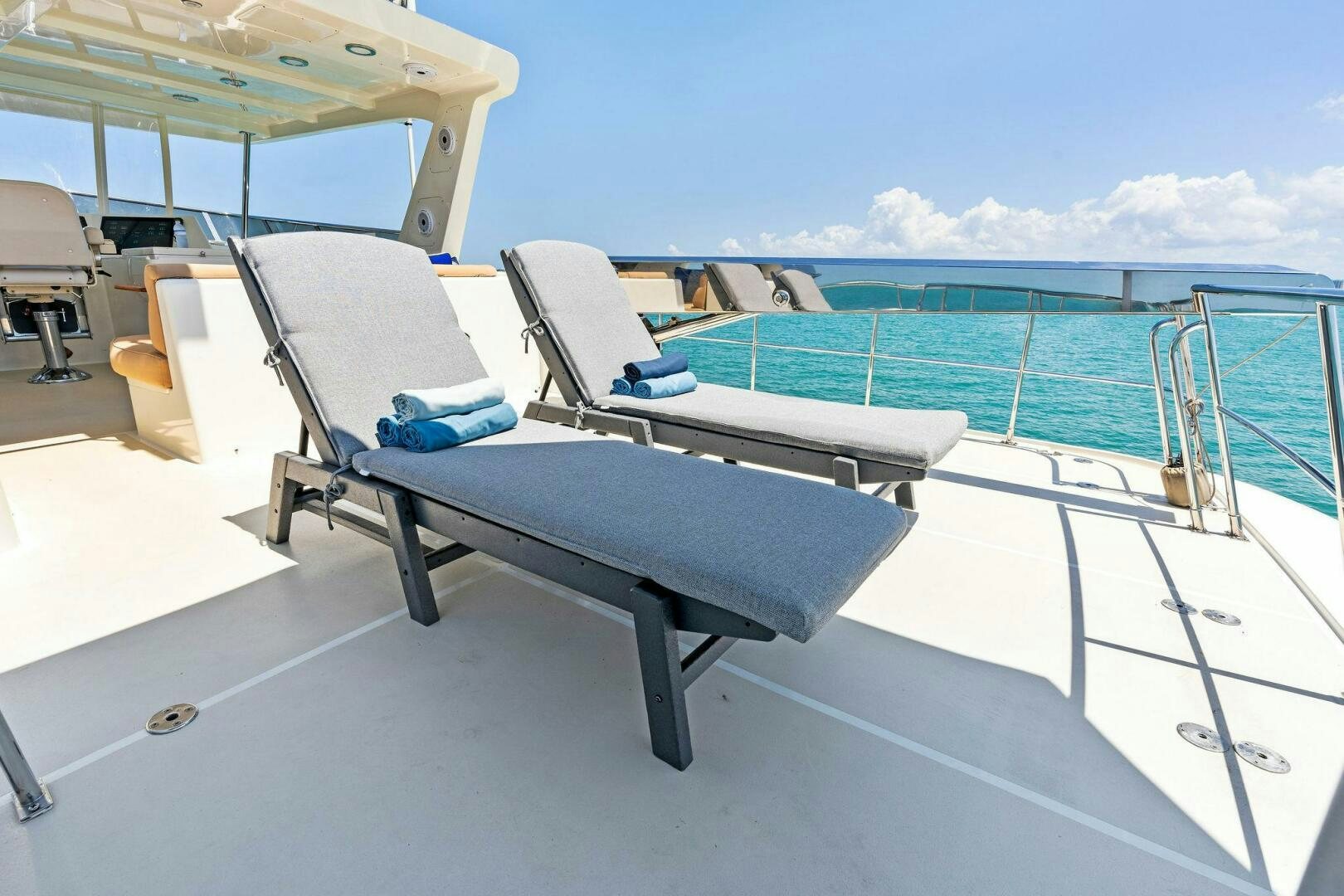 a pool with a table and chairs aboard RELENTLESS Yacht for Sale