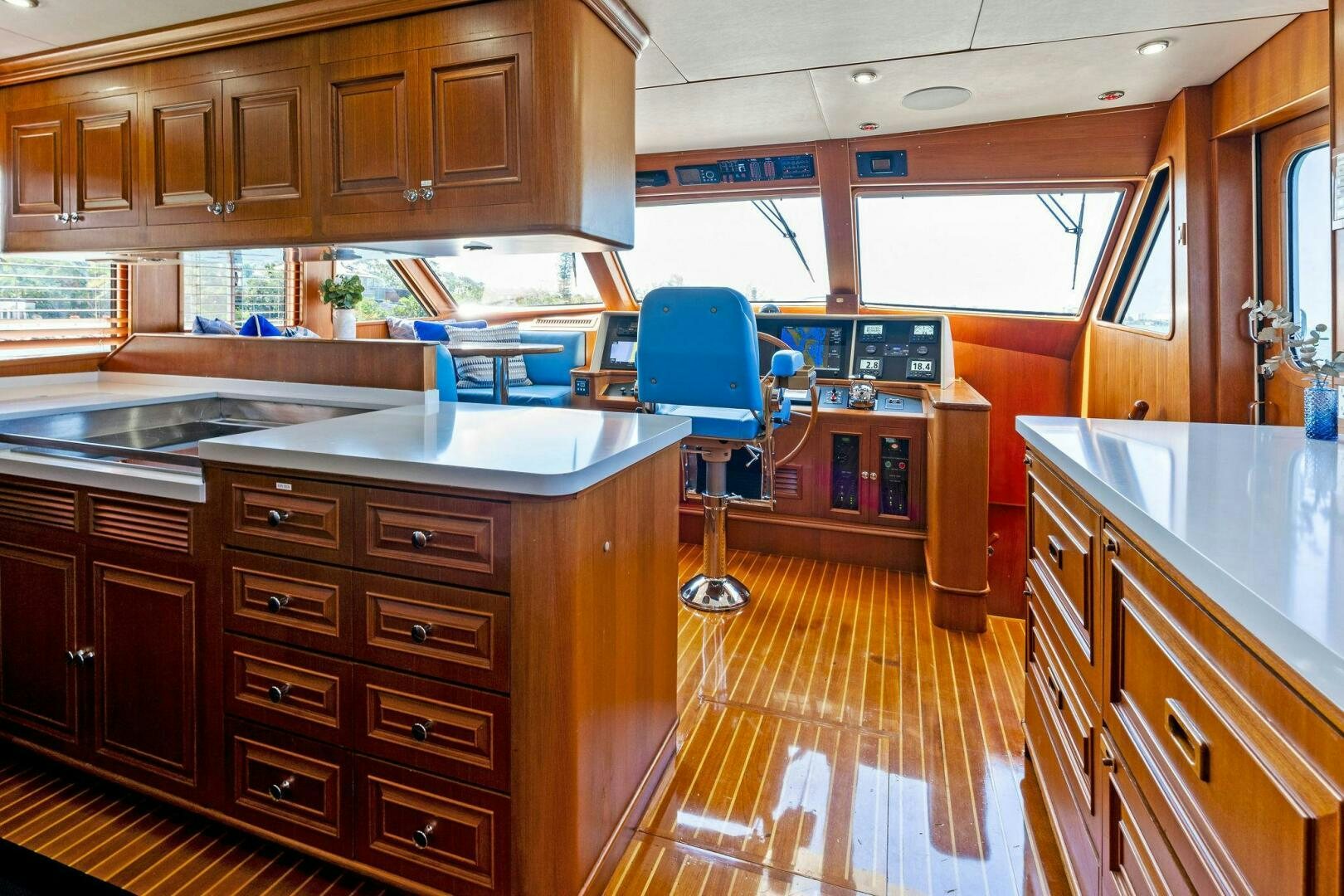 a kitchen with wooden cabinets aboard RELENTLESS Yacht for Sale