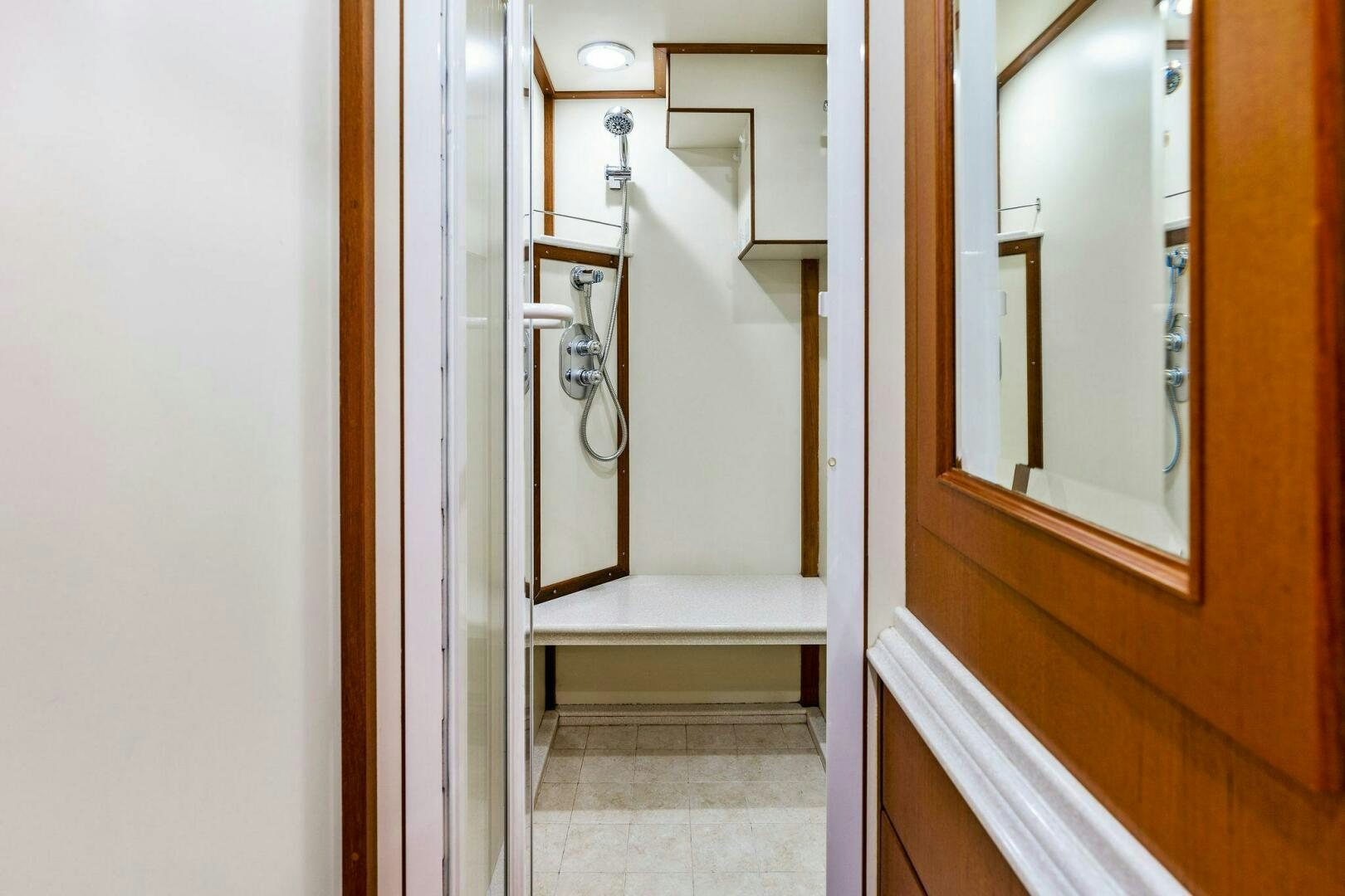 a door with a mirror aboard RELENTLESS Yacht for Sale