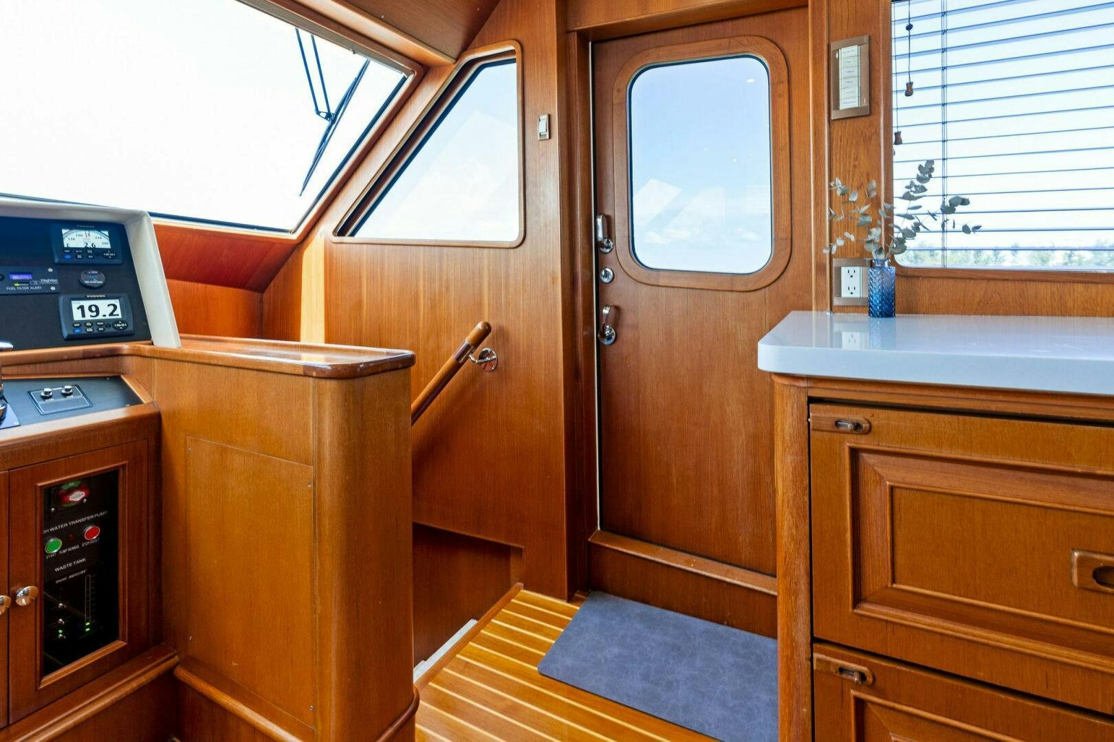 a room with wooden cabinets aboard RELENTLESS Yacht for Sale