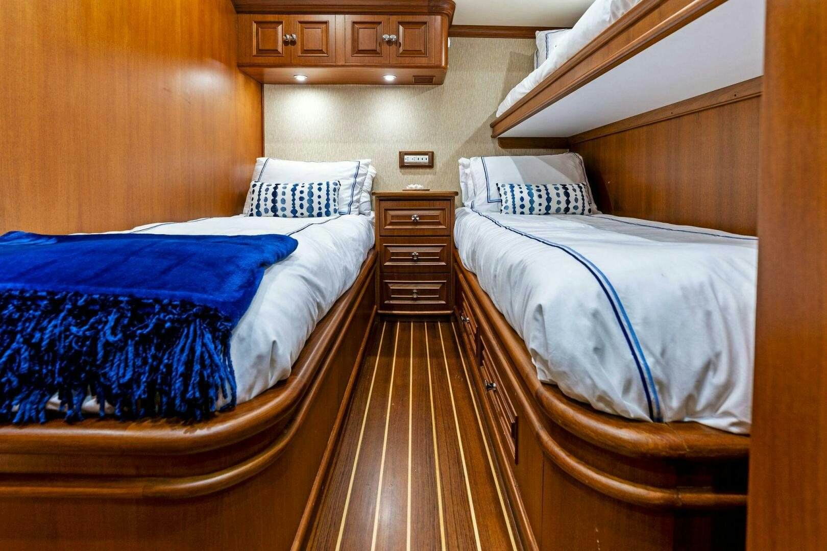 a couple of beds in a room aboard RELENTLESS Yacht for Sale
