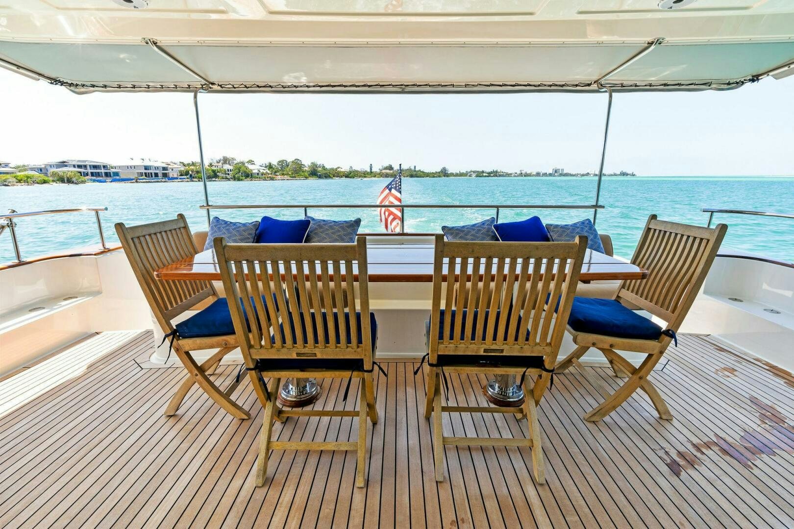 a group of chairs on a deck aboard RELENTLESS Yacht for Sale