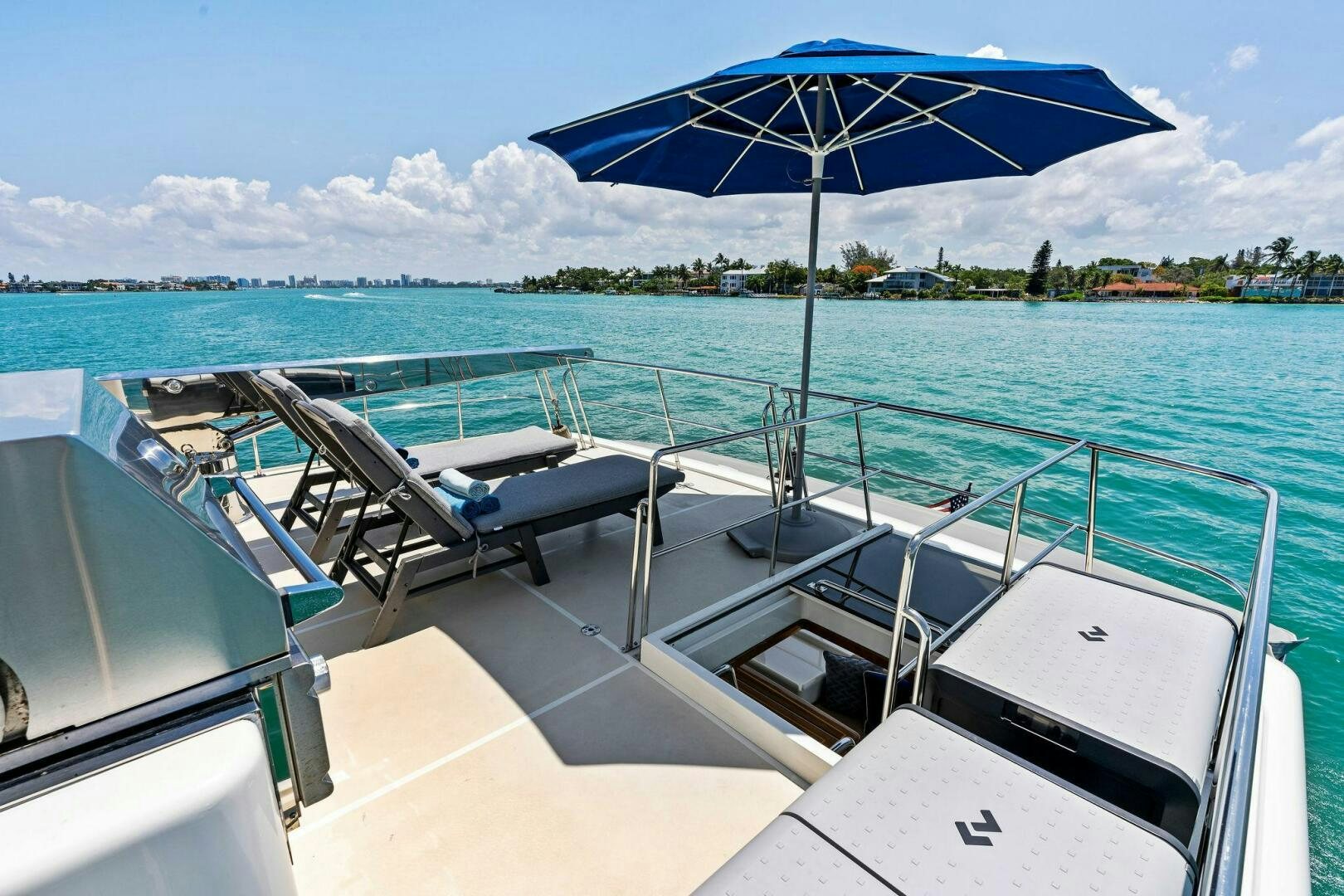 a boat with an umbrella on it aboard RELENTLESS Yacht for Sale