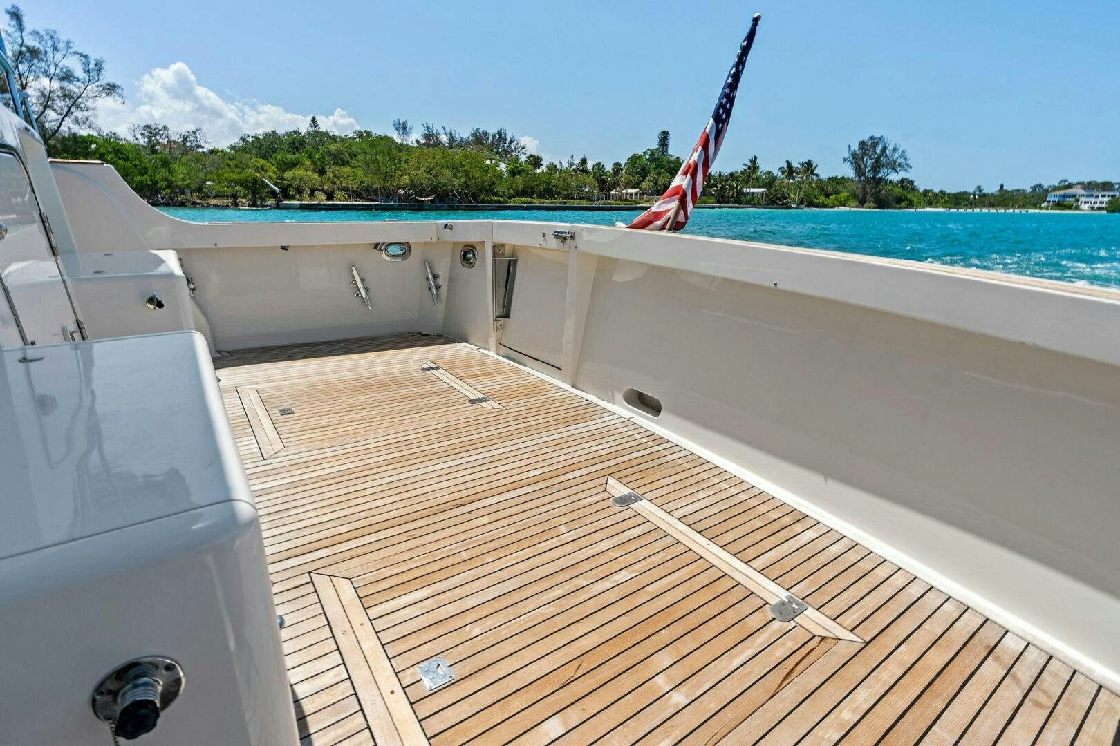 a deck with a flag on it aboard RELENTLESS Yacht for Sale