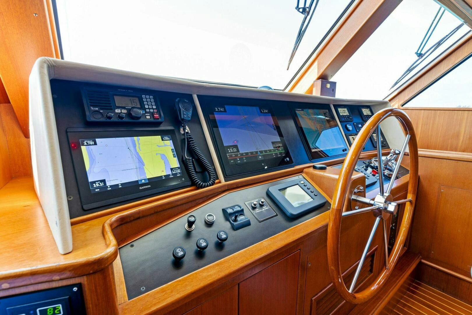 a wooden cabinet with electronic devices aboard RELENTLESS Yacht for Sale