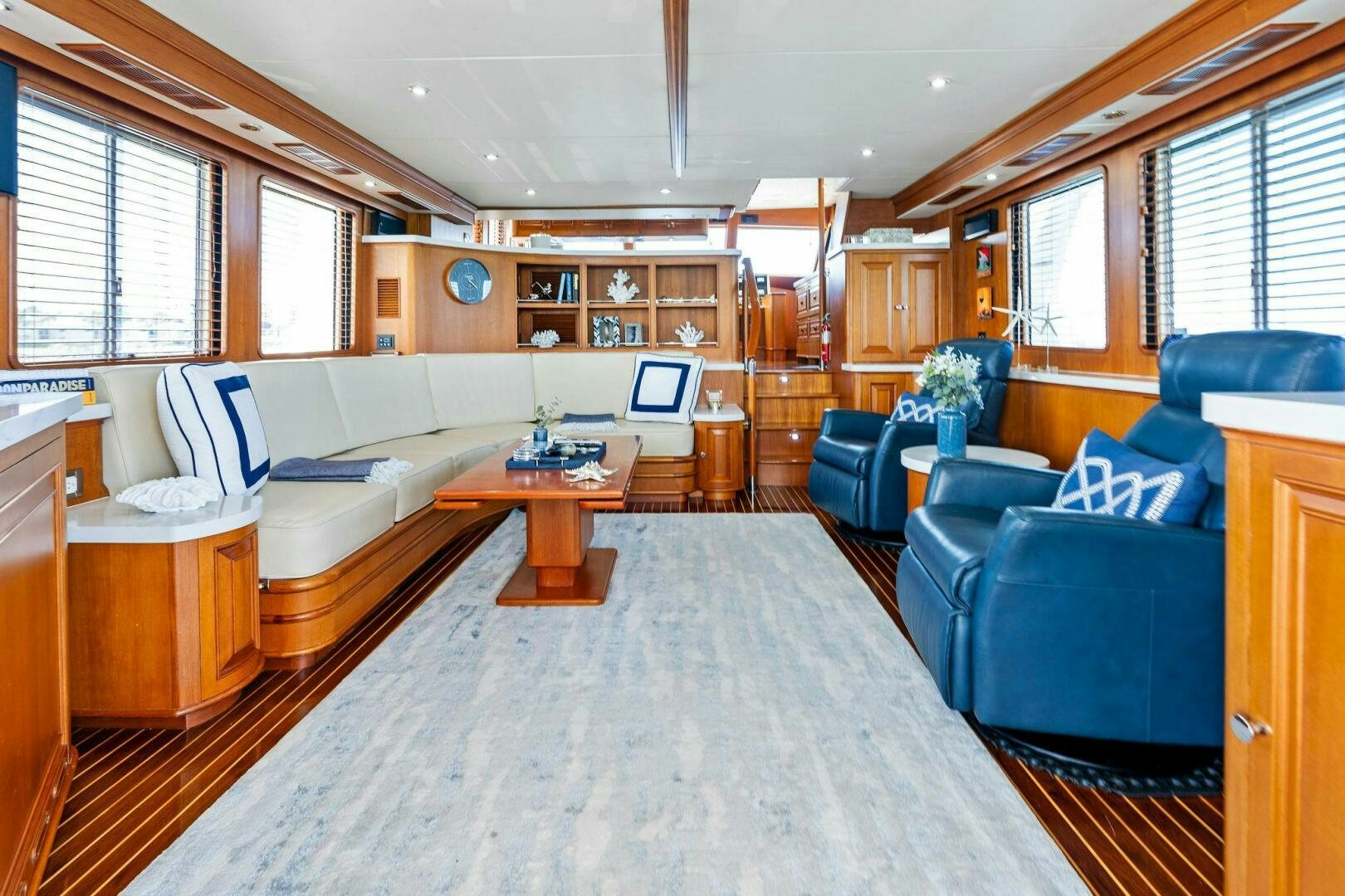 a living room with a couch and a table aboard RELENTLESS Yacht for Sale