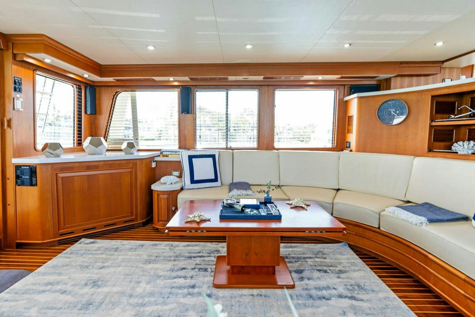 a living room with a couch and a coffee table aboard RELENTLESS Yacht for Sale