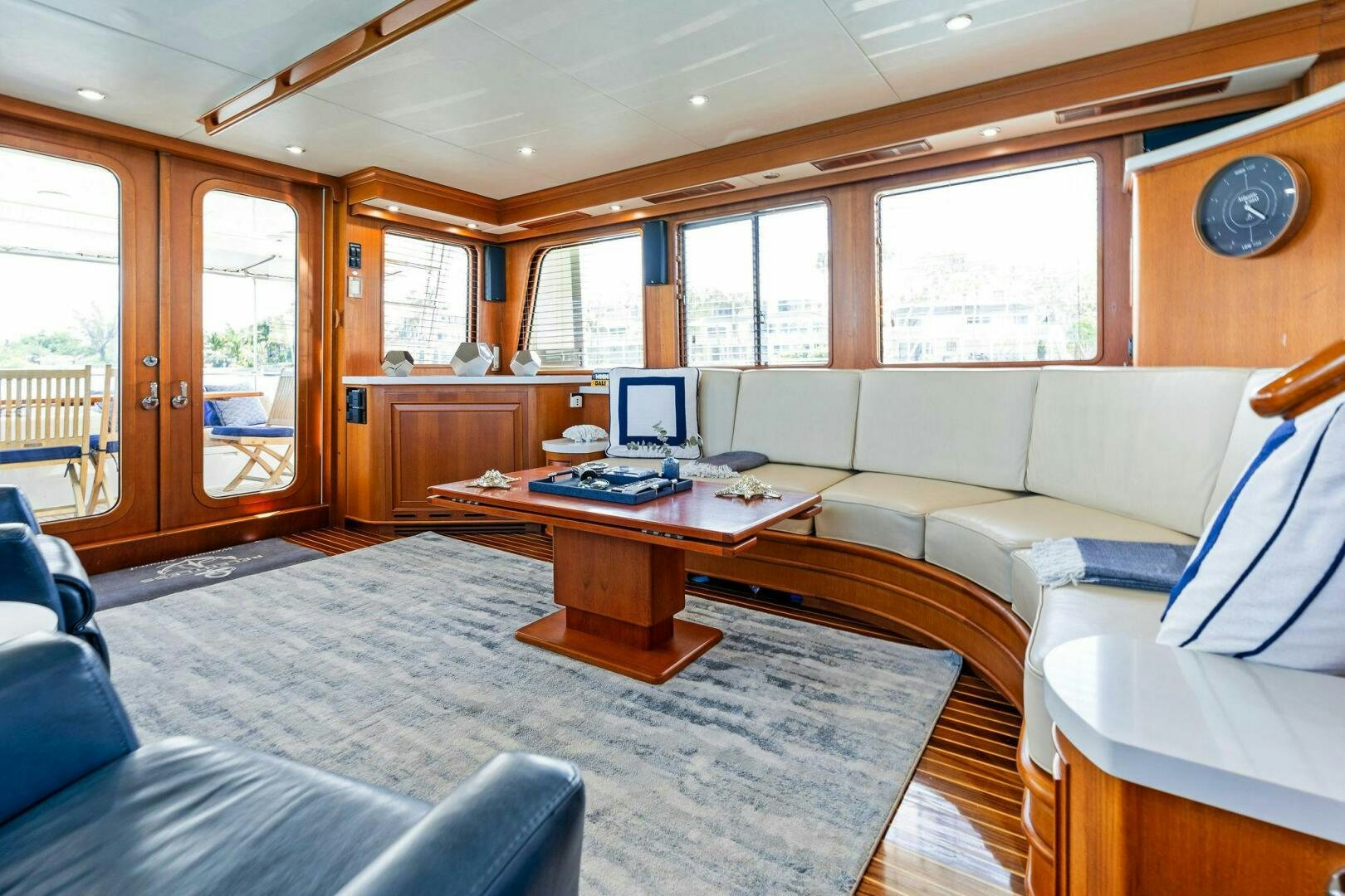 a living room with a couch and a table aboard RELENTLESS Yacht for Sale