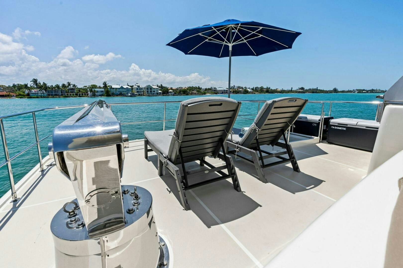 chairs and umbrella on a boat aboard RELENTLESS Yacht for Sale
