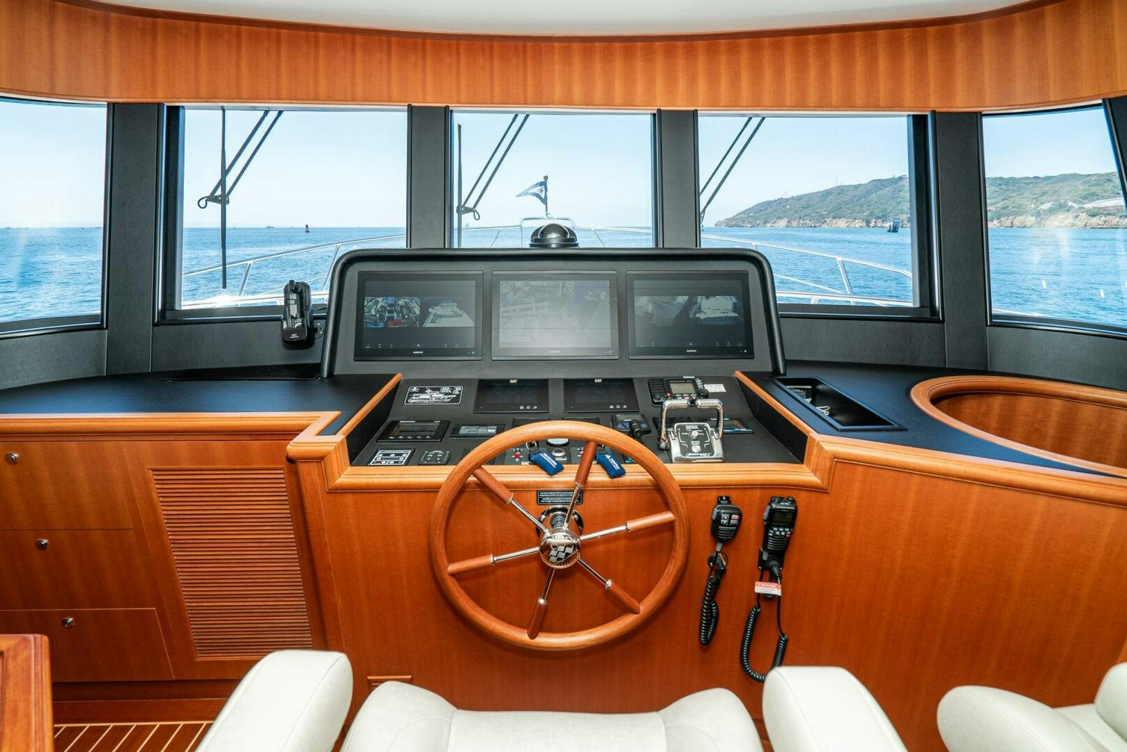a wooden boat with a steering wheel aboard KING OF NOTHING Yacht for Sale