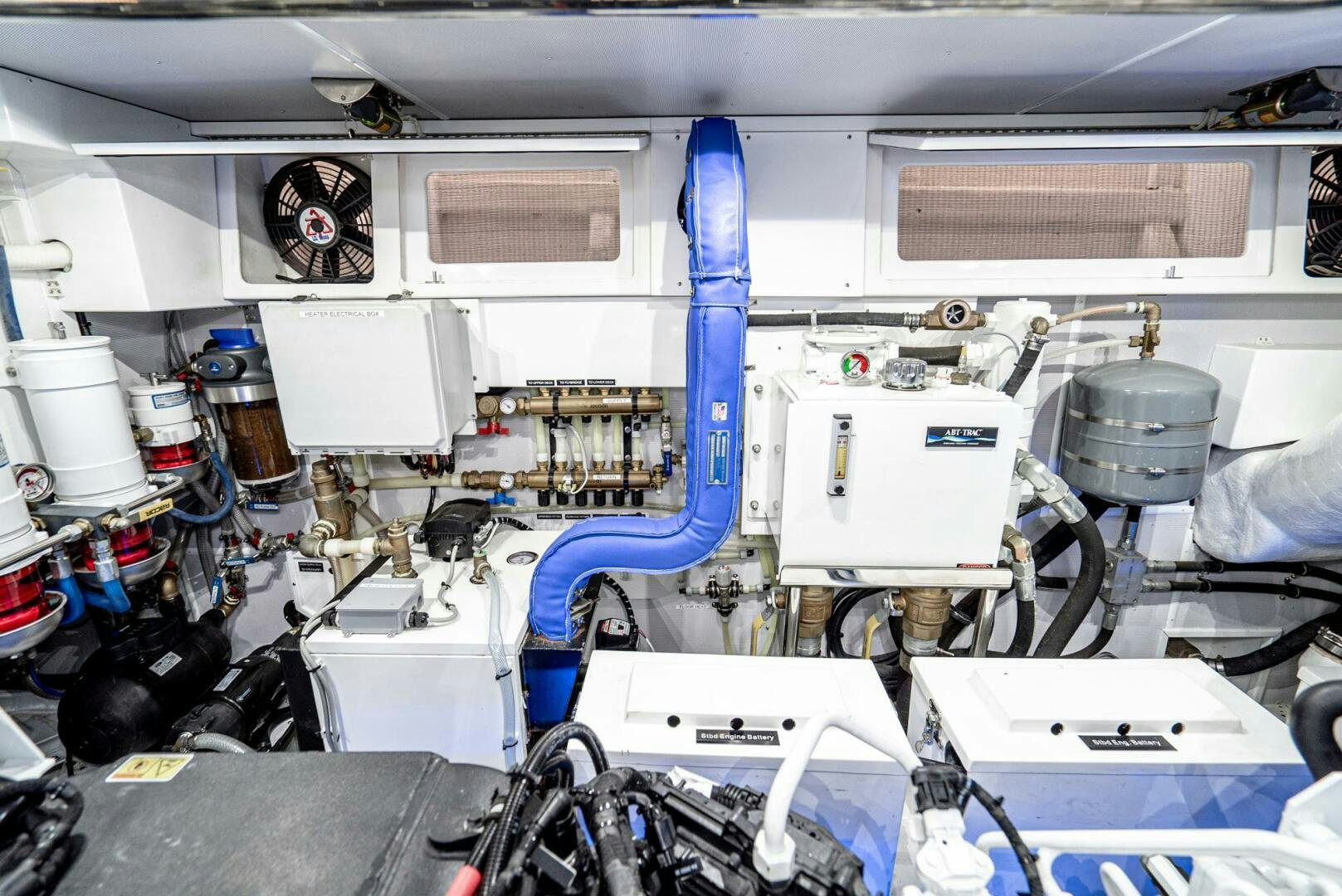 a white vehicle with blue pipes aboard KING OF NOTHING Yacht for Sale