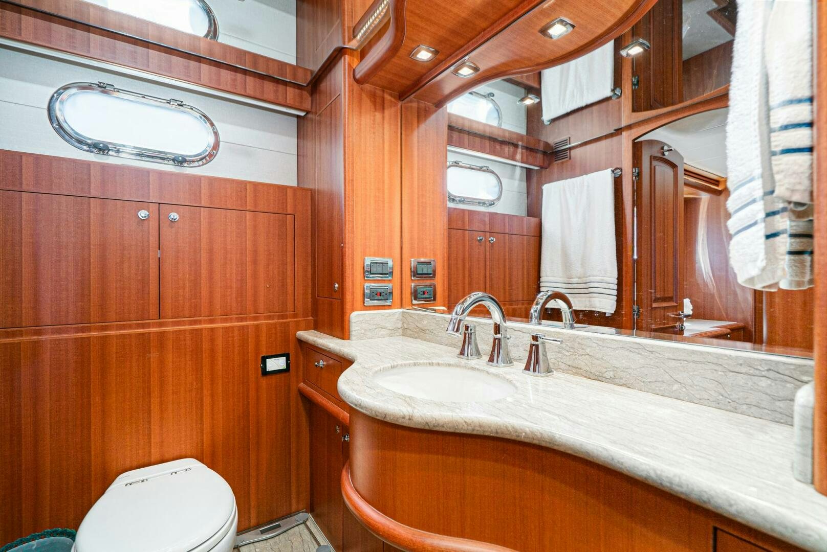 a bathroom with a sink and a toilet aboard KING OF NOTHING Yacht for Sale