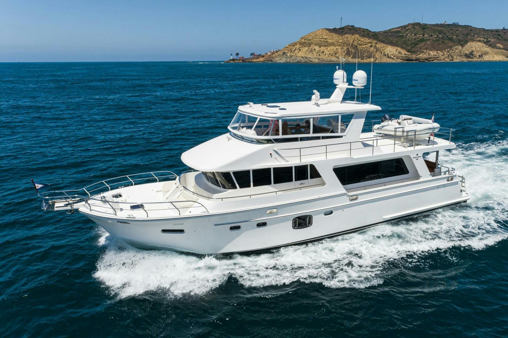 a white yacht on the water aboard KING OF NOTHING Yacht for Sale