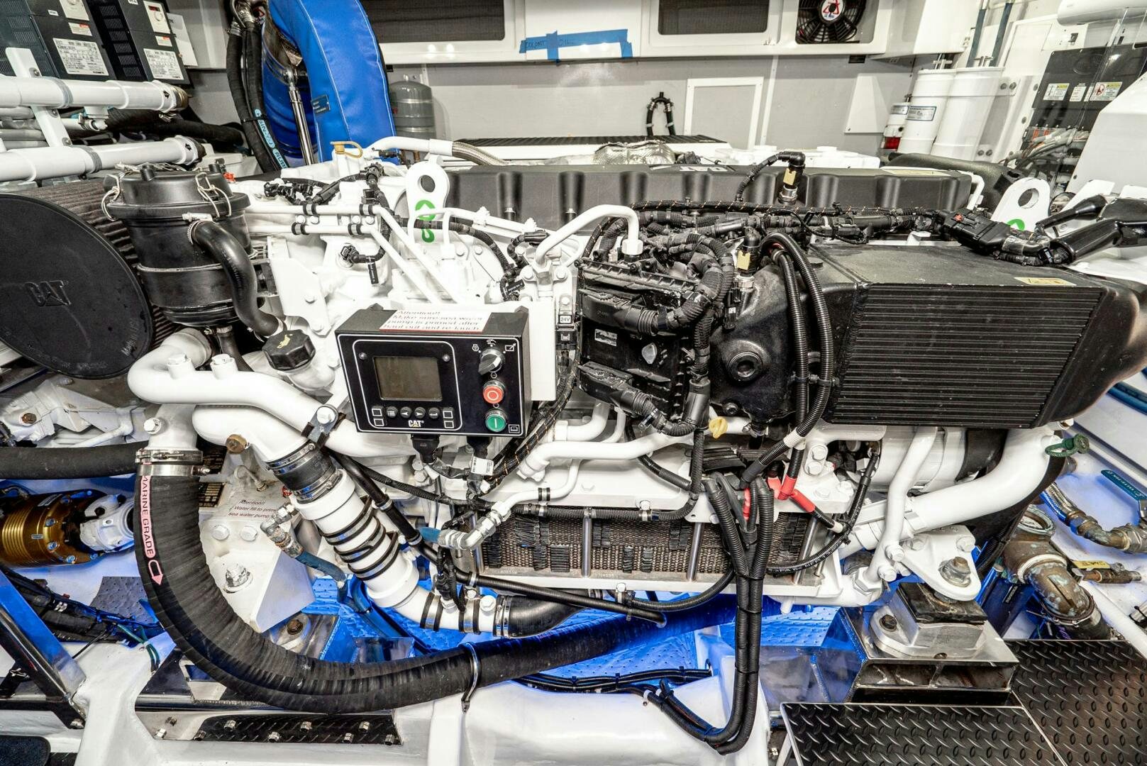a car engine with a blue hood aboard KING OF NOTHING Yacht for Sale