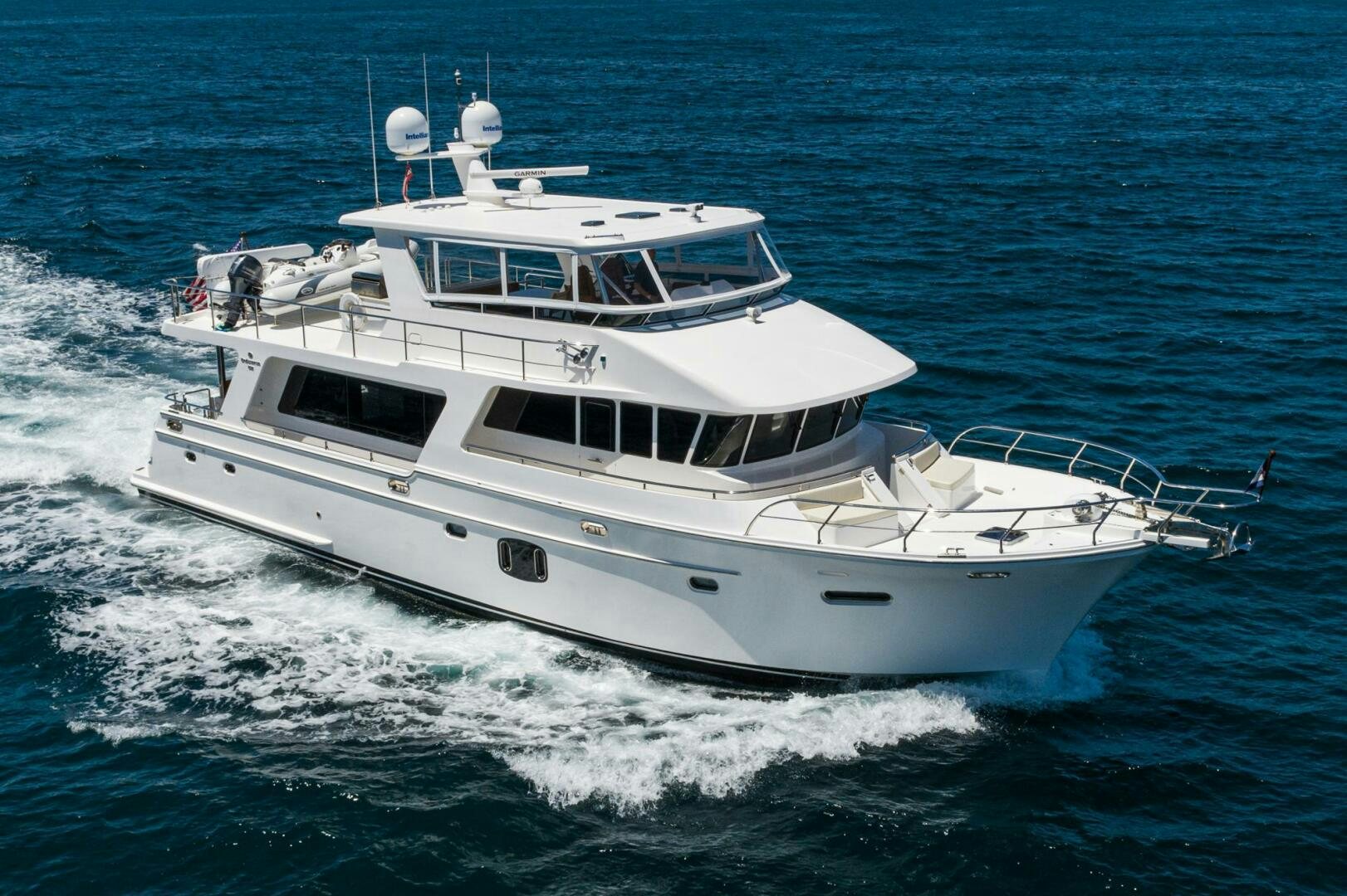 a white boat on the water aboard KING OF NOTHING Yacht for Sale