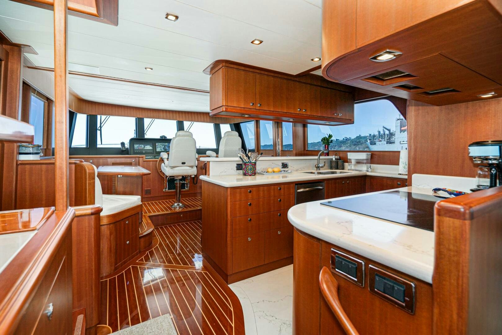 a kitchen with wooden cabinets aboard KING OF NOTHING Yacht for Sale