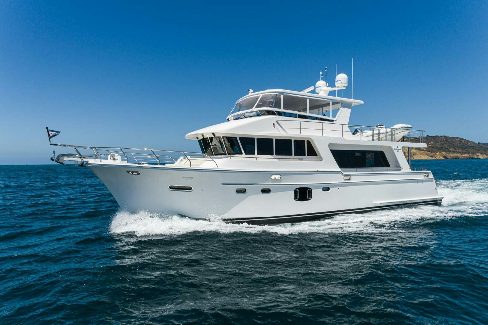 a white boat on the water aboard KING OF NOTHING Yacht for Sale