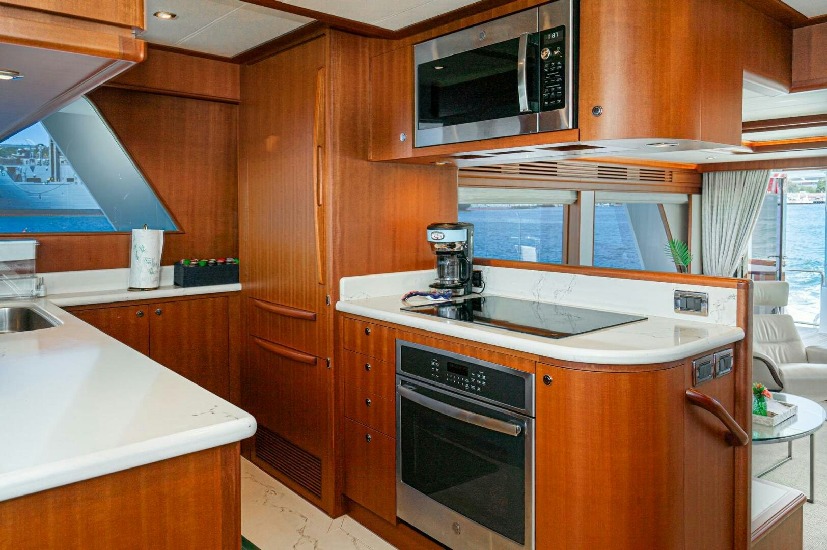 a kitchen with wooden cabinets aboard KING OF NOTHING Yacht for Sale