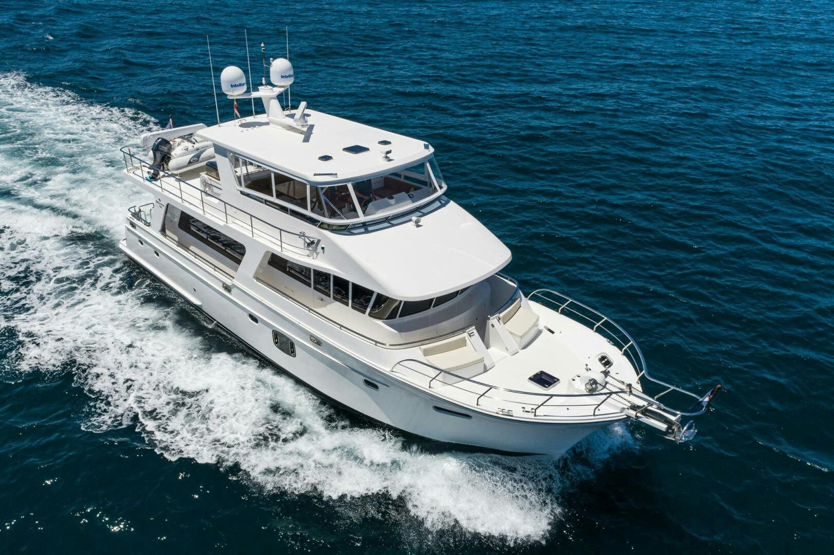 a white boat on the water aboard KING OF NOTHING Yacht for Sale